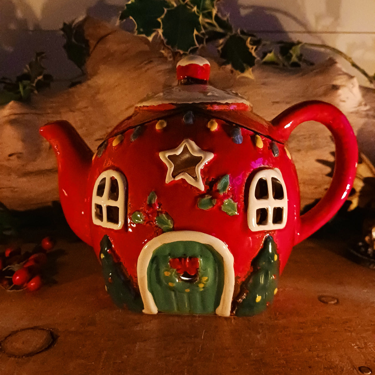 Add a touch of charm and character to your festive display with the Village Pottery Xmas Teapot House Tealight. Combining the familiar shape of a traditional teapot with the appearance of a miniature Christmas house, this unusual decorative tealight holder makes a delightful addition to your seasonal décor.