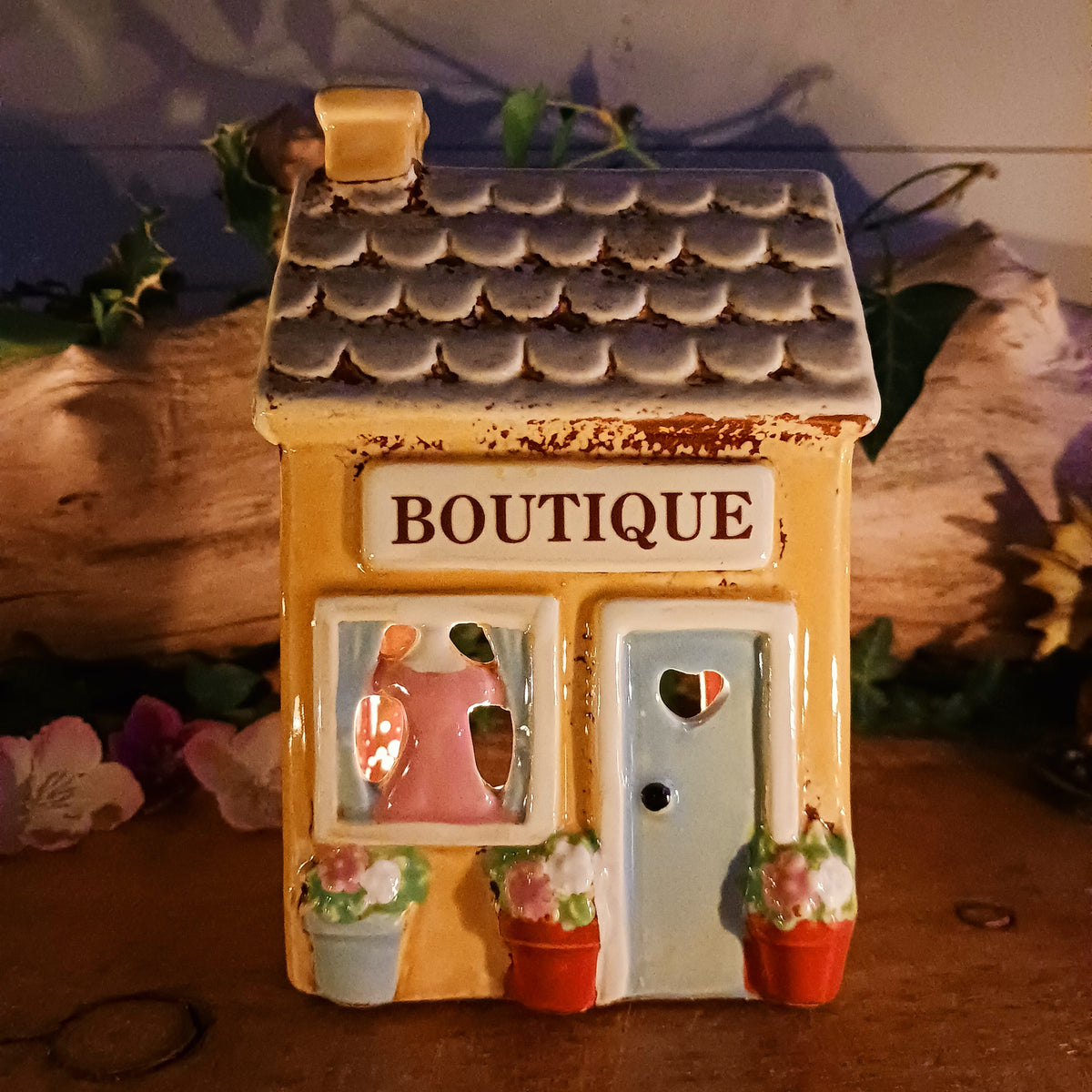 Bring a little village charm into your home with this delightful Village Pottery Boutique Tealight Holder. Hand-crafted in ceramic and beautifully hand-painted, this charming miniature shop makes a lovely decorative feature both with or without a candle.