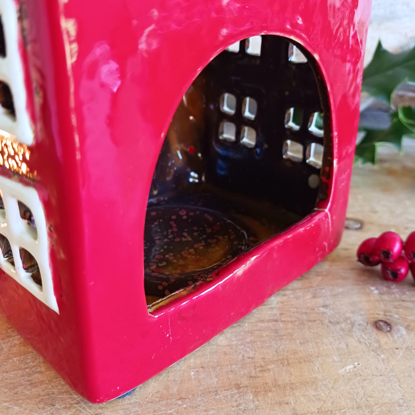 Bring timeless festive charm into your home with the Village Pottery Christmas Thatched Roof House Tealight Holder, a handcrafted ceramic cottage glowing with the spirit of the season. Measuring 17 x 12.5 x 8.5 cm, this enchanting piece captures the essence of a peaceful winter’s night — where golden candlelight flickers through snowy windows beneath a soft thatched roof.