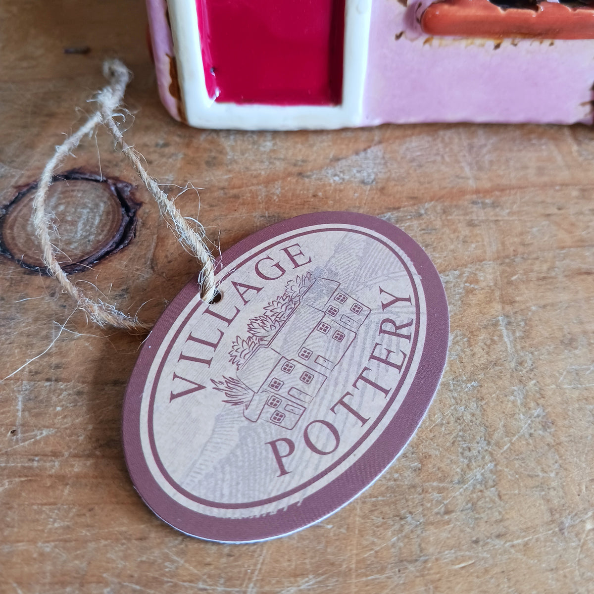 Bring the charm of a quaint village high street into your home with this delightful Village Pottery Wine Bar Tealight Holder. Hand-crafted from ceramic and beautifully hand-painted, this charming miniature wine bar is packed with character and intricate details.