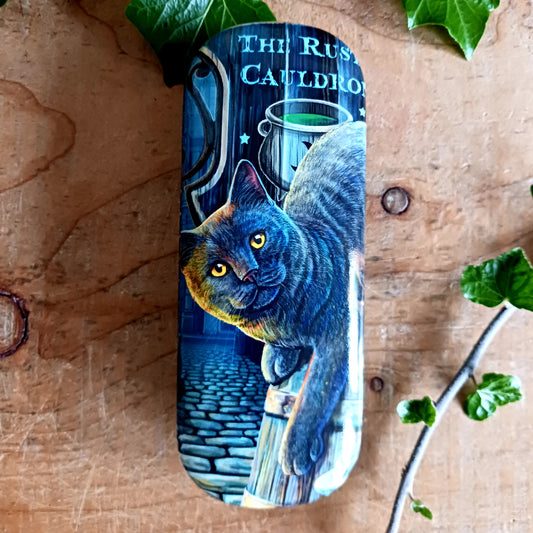 Protect your spectacles in enchanting style with this hard shell glasses case featuring Lisa Parker’s ‘Rusty Cauldron’ artwork. Designed to guard your eyewear from scratches, pressure, and everyday wear, this sturdy case is perfect for handbags, backpacks, or bedside storage.