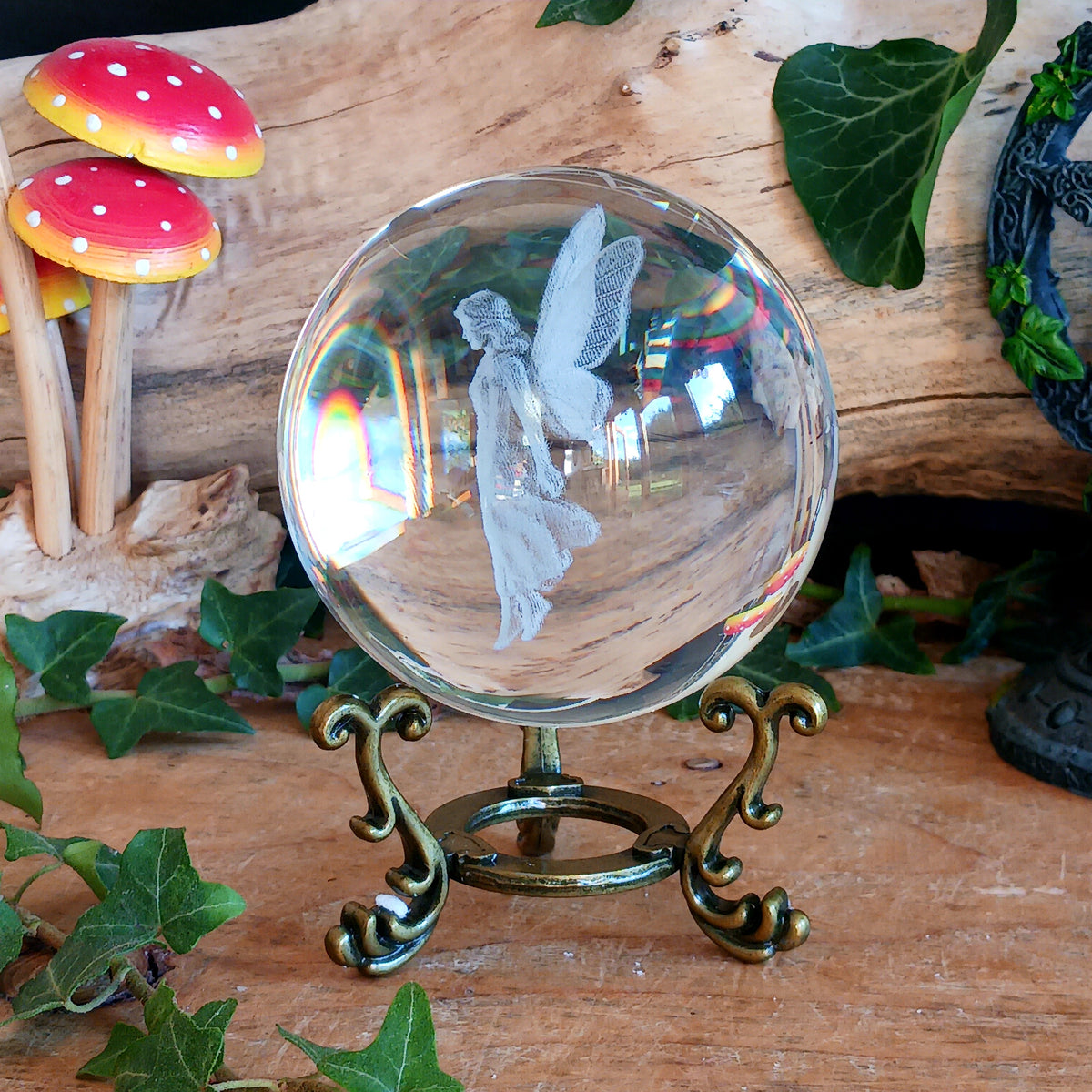 Capture a little woodland magic with this beautiful fairy crystal ball ornament, featuring an ethereal fairy figure delicately laser engraved inside a clear glass crystal ball. Displayed on an ornate antique-style stand, it makes a charming decorative piece for anyone who loves fairies, fantasy and magical woodland-inspired interiors.