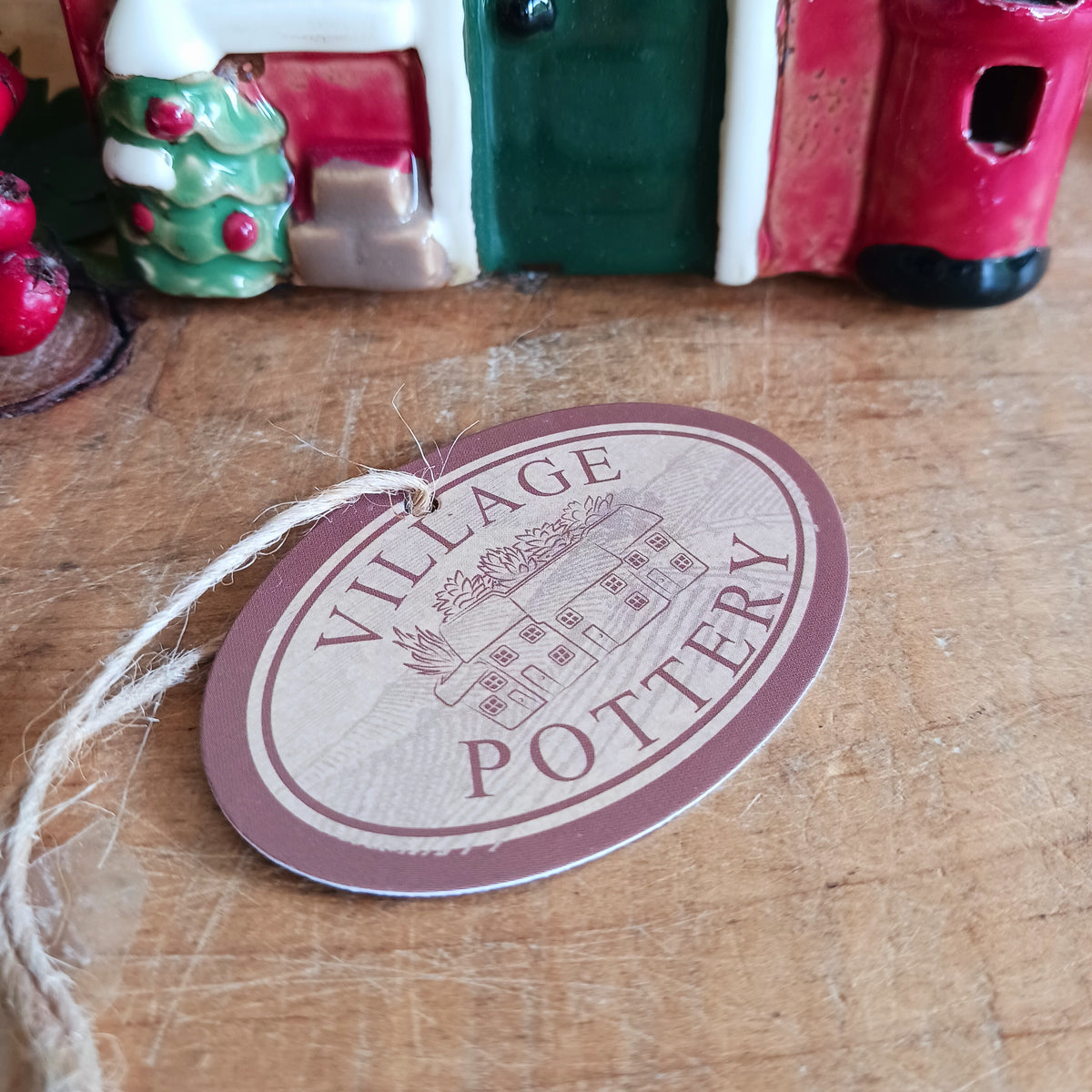 Create a cosy Christmas village scene with this charming Village Pottery Christmas Post Office Tealight Holder. Beautifully detailed as a traditional snowy village post office, it features a snow-covered roof, a post box and a delightful robin decoration for a wonderfully festive look.