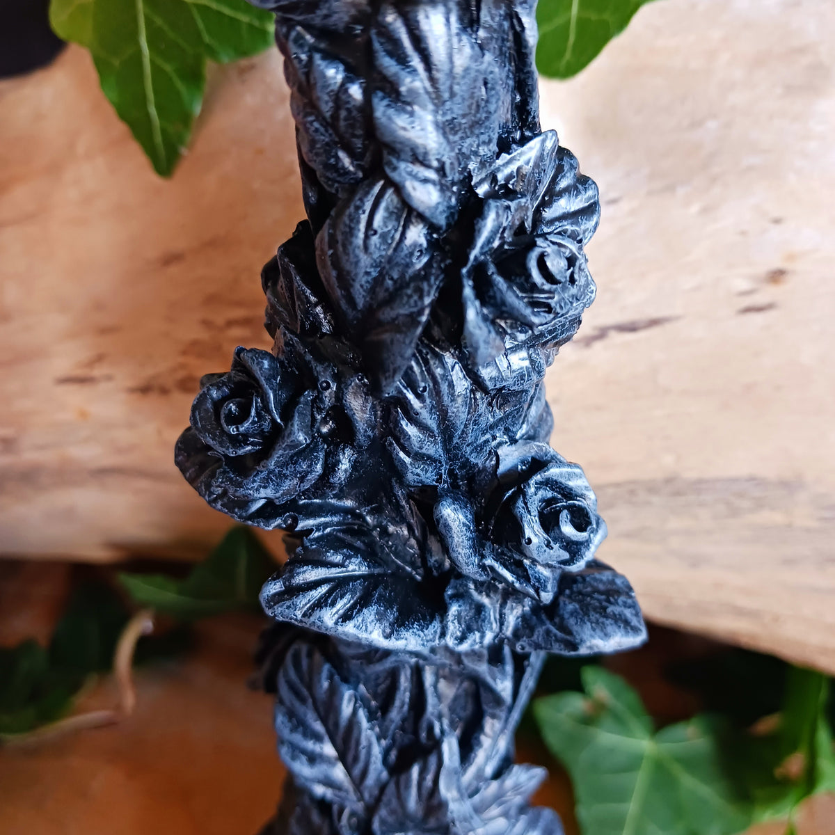 Add a touch of dark elegance to your home with the Midnight Rose Gothic Candlestick Holder. Beautifully crafted with a stone pillar design, this striking ornament features intricate black roses and dark vegetation, creating a mysterious gothic aesthetic that makes a statement in any room.