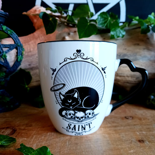 In a world where every cat has two sides—the purring saint basking in sunlight and the midnight prowler plotting chaos—balance is everything. The Saint or Sinner Cat Mug celebrates that duality with charming, original artwork that lets you choose your mood with every sip.