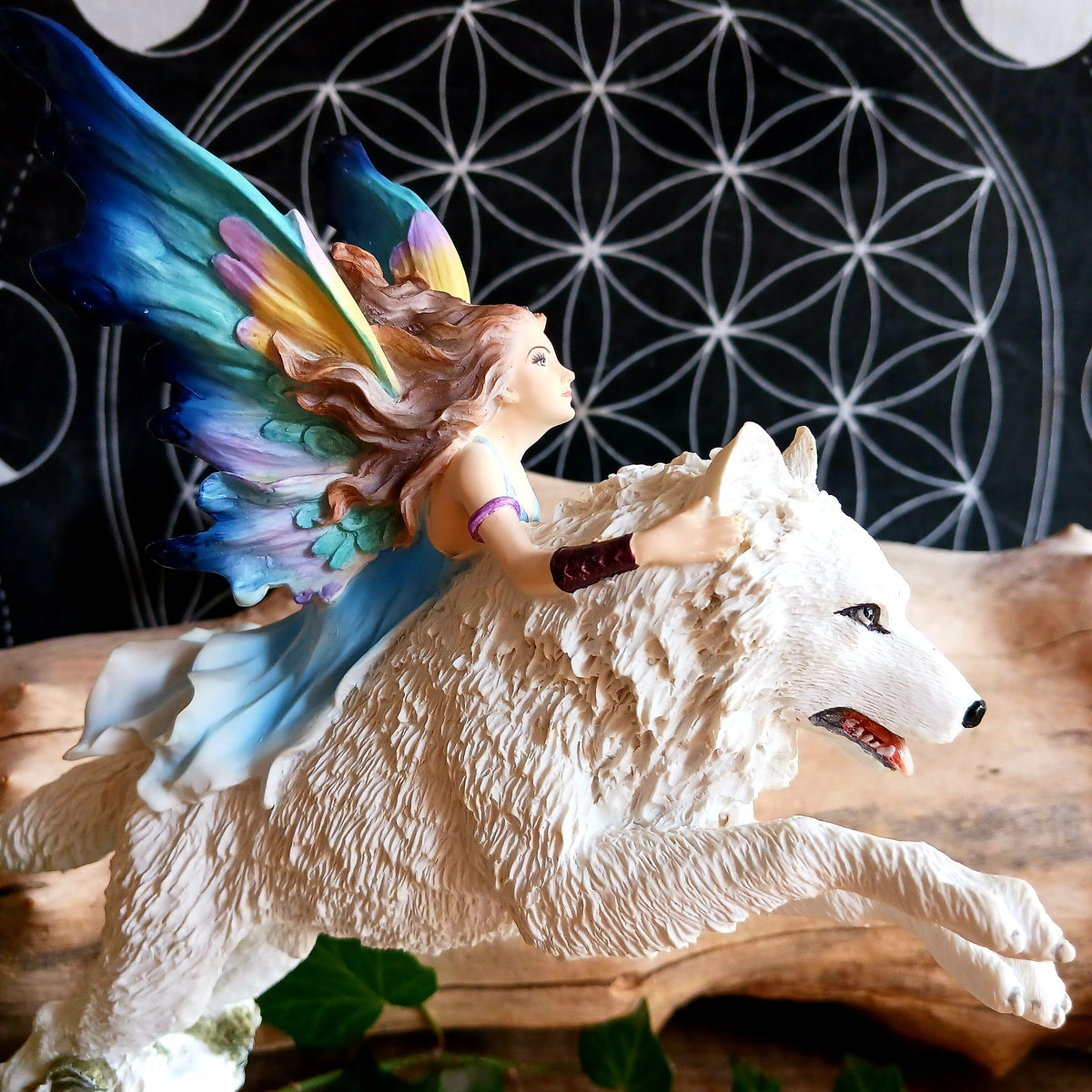 Bring a touch of magical fantasy to your home with this beautifully detailed Fairy Riding A White Wolf Statue from Nemesis Now. The dramatic figurine depicts a graceful fairy riding her loyal white wolf companion as they leap over a flowing stream, creating a striking sense of movement and adventure.