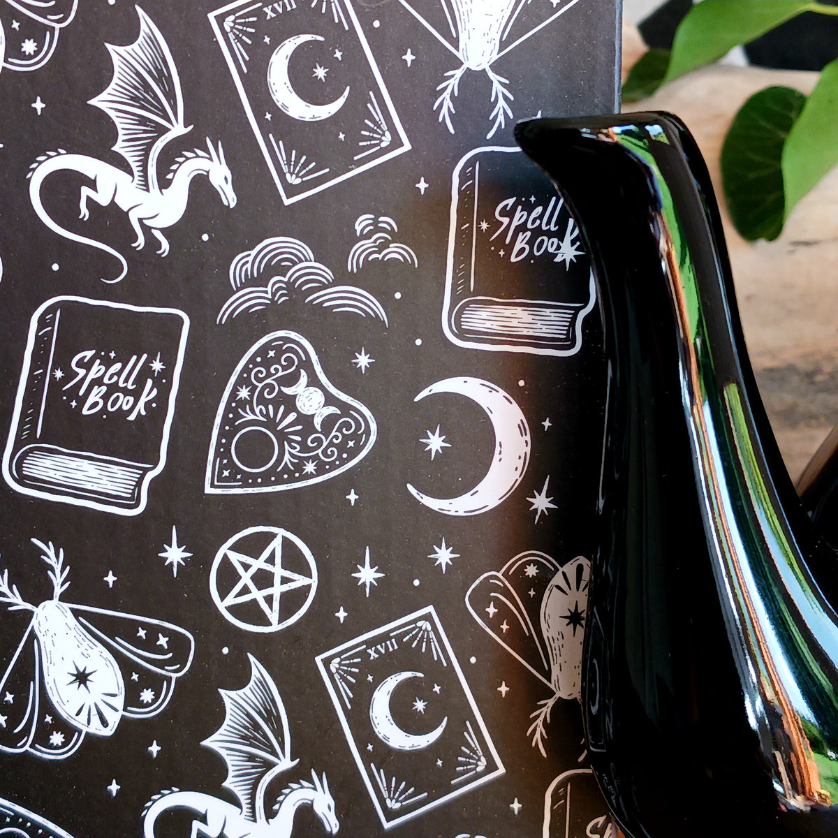 Add a touch of celestial magic to tea time with this striking black ceramic teapot, beautifully decorated with moon and star details and finished with a statement star-shaped lid.