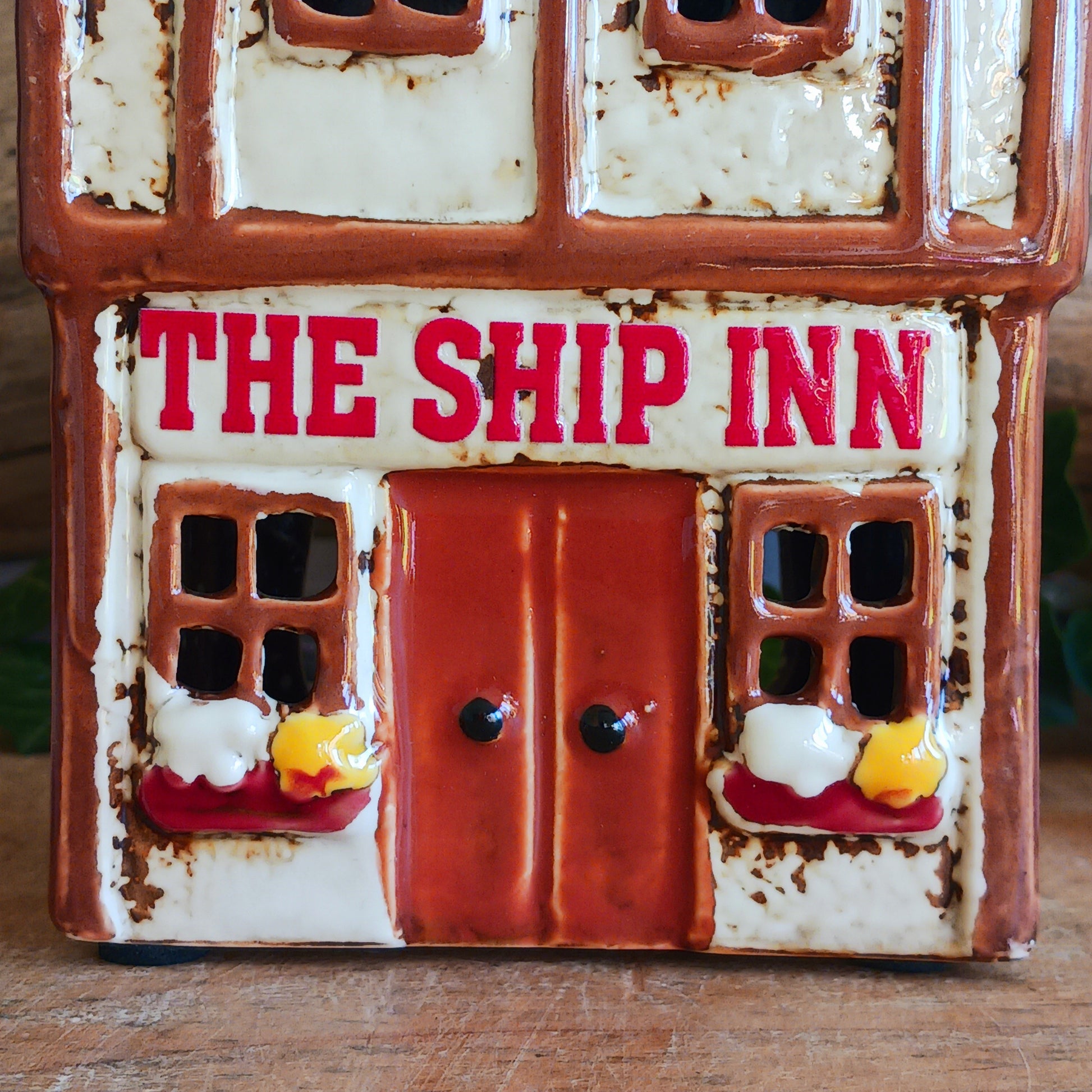 A lantern-lit refuge upon an enchanted street, the Tudor Ship Inn glows with the warmth of stories carried on twilight air. This Shudehill Village Pottery tealight house is crafted from ceramic, its windows flickering with candlelight like a haven for wandering souls.