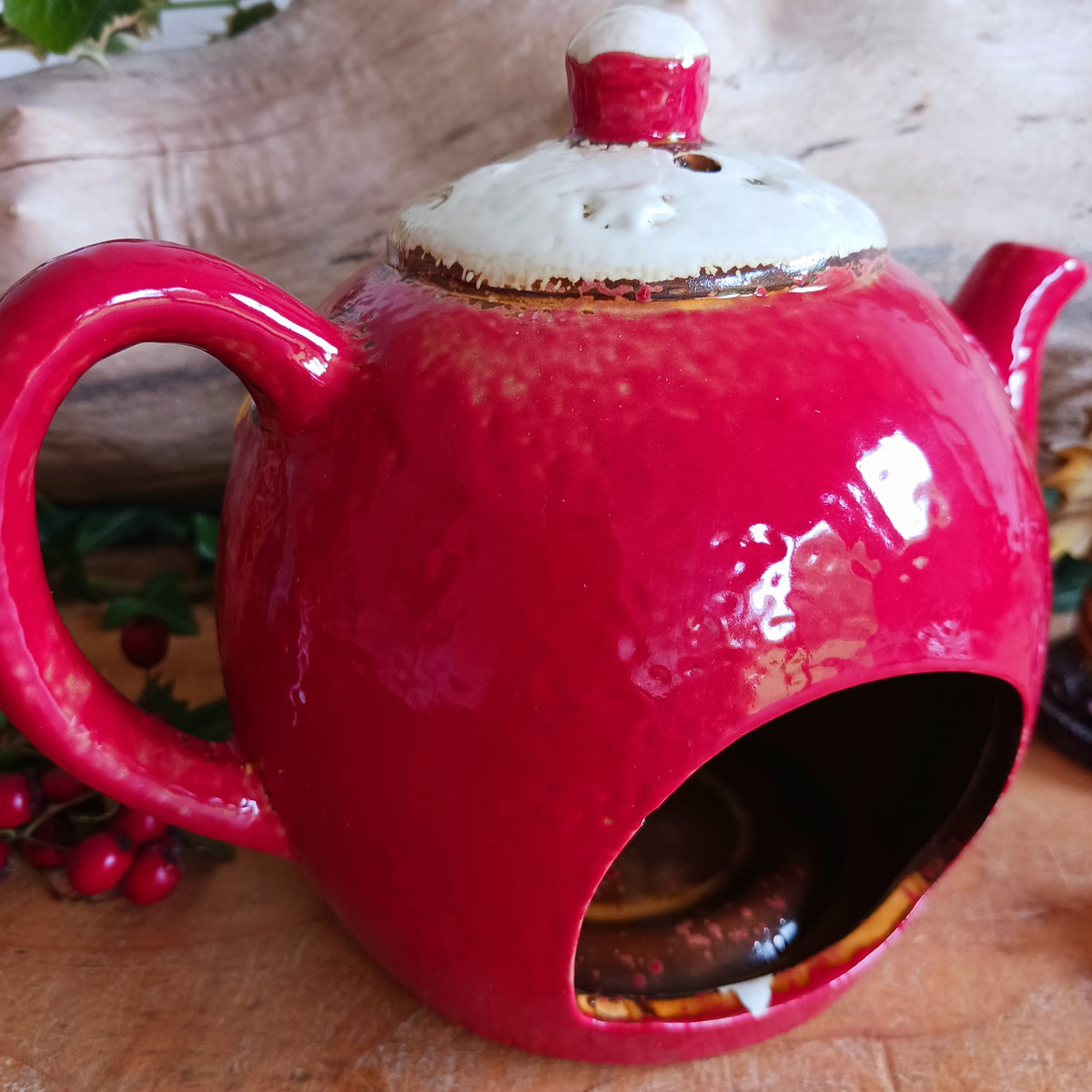 Add a touch of charm and character to your festive display with the Village Pottery Xmas Teapot House Tealight. Combining the familiar shape of a traditional teapot with the appearance of a miniature Christmas house, this unusual decorative tealight holder makes a delightful addition to your seasonal décor.
