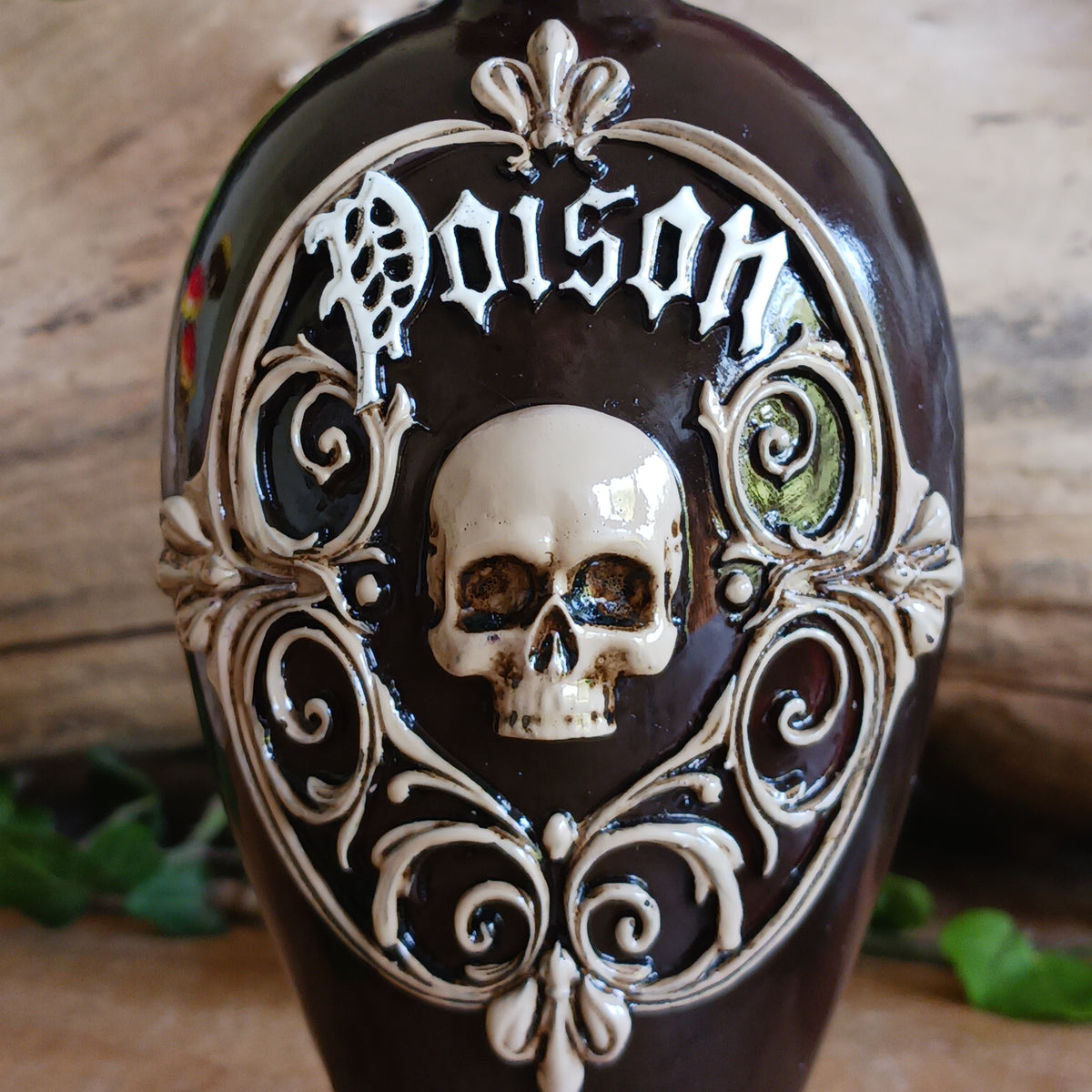 Add a touch of dark gothic elegance to your home with this striking Poison Potion Bottle decorative figurine. Designed to resemble a mysterious deadly potion bottle, it makes a dramatic addition to gothic, alternative, fantasy and Halloween-inspired interiors.