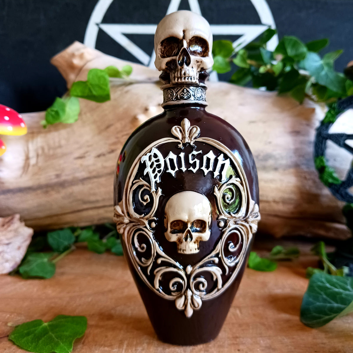 Add a touch of dark gothic elegance to your home with this striking Poison Potion Bottle decorative figurine. Designed to resemble a mysterious deadly potion bottle, it makes a dramatic addition to gothic, alternative, fantasy and Halloween-inspired interiors.