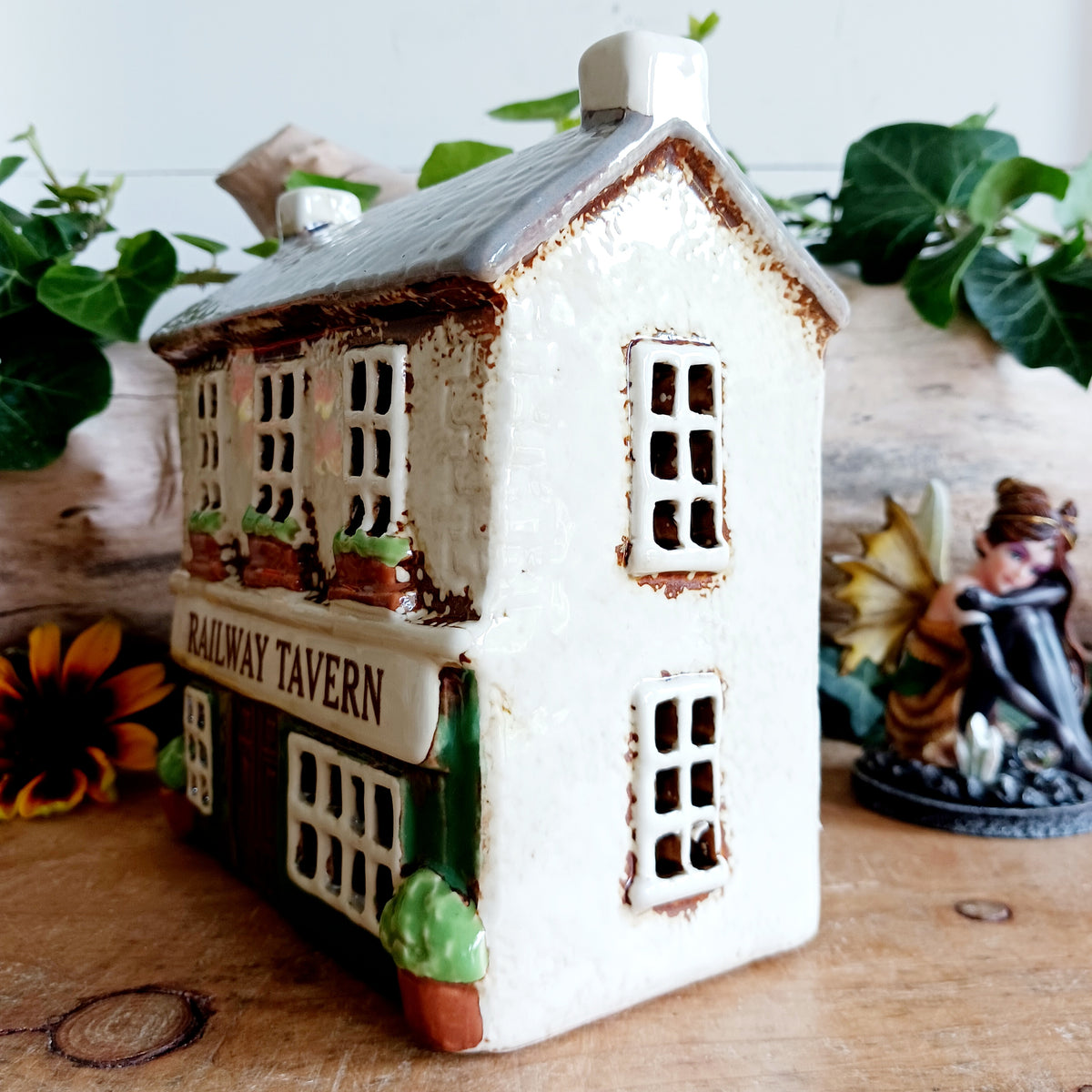 Bring a little British village charm into your home with this delightful Village Tavern Tealight Holder, beautifully hand-crafted in ceramic and hand-painted with charming, characterful details.