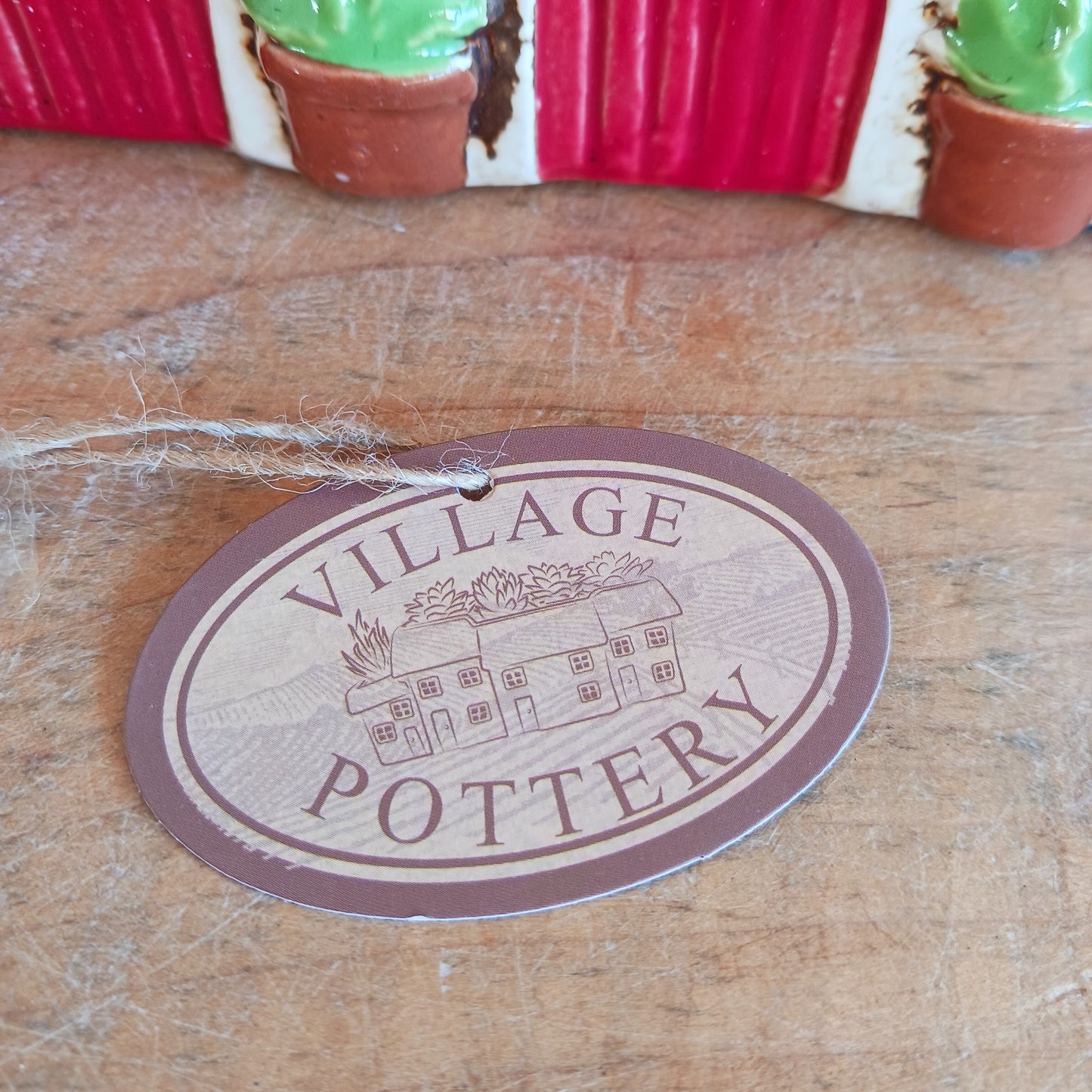 Nestled at the edge of a quiet enchanted village, The Stables tealight house by Village Pottery glows with a soft, grounding warmth. Crafted from ceramic and measuring 17x8x8cm, this rustic stable invites candlelight to flicker through its windows like a lantern for wandering spirits and kindred souls.