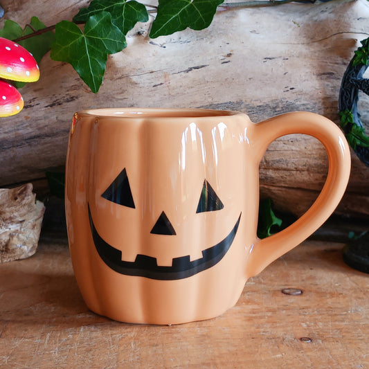 Enjoy your favourite Halloween brews in spooky style with this smiling Jack-o'-lantern pumpkin mug! Featuring a fun pumpkin-shaped design and a cheerful smiling face, this novelty Halloween mug is perfect for adding a touch of seasonal charm to your morning coffee, afternoon tea or favourite hot chocolate.