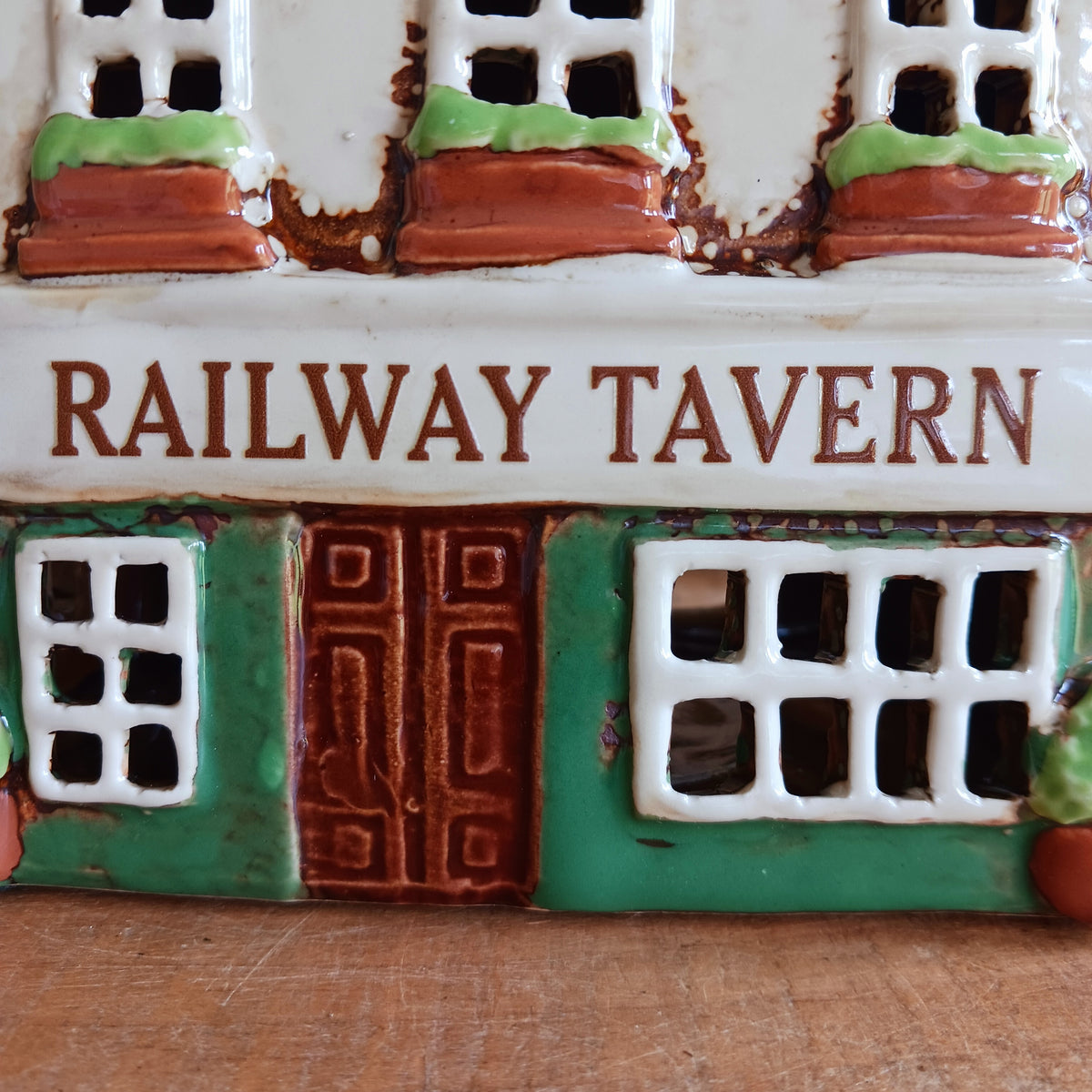 Bring a little British village charm into your home with this delightful Village Tavern Tealight Holder, beautifully hand-crafted in ceramic and hand-painted with charming, characterful details.