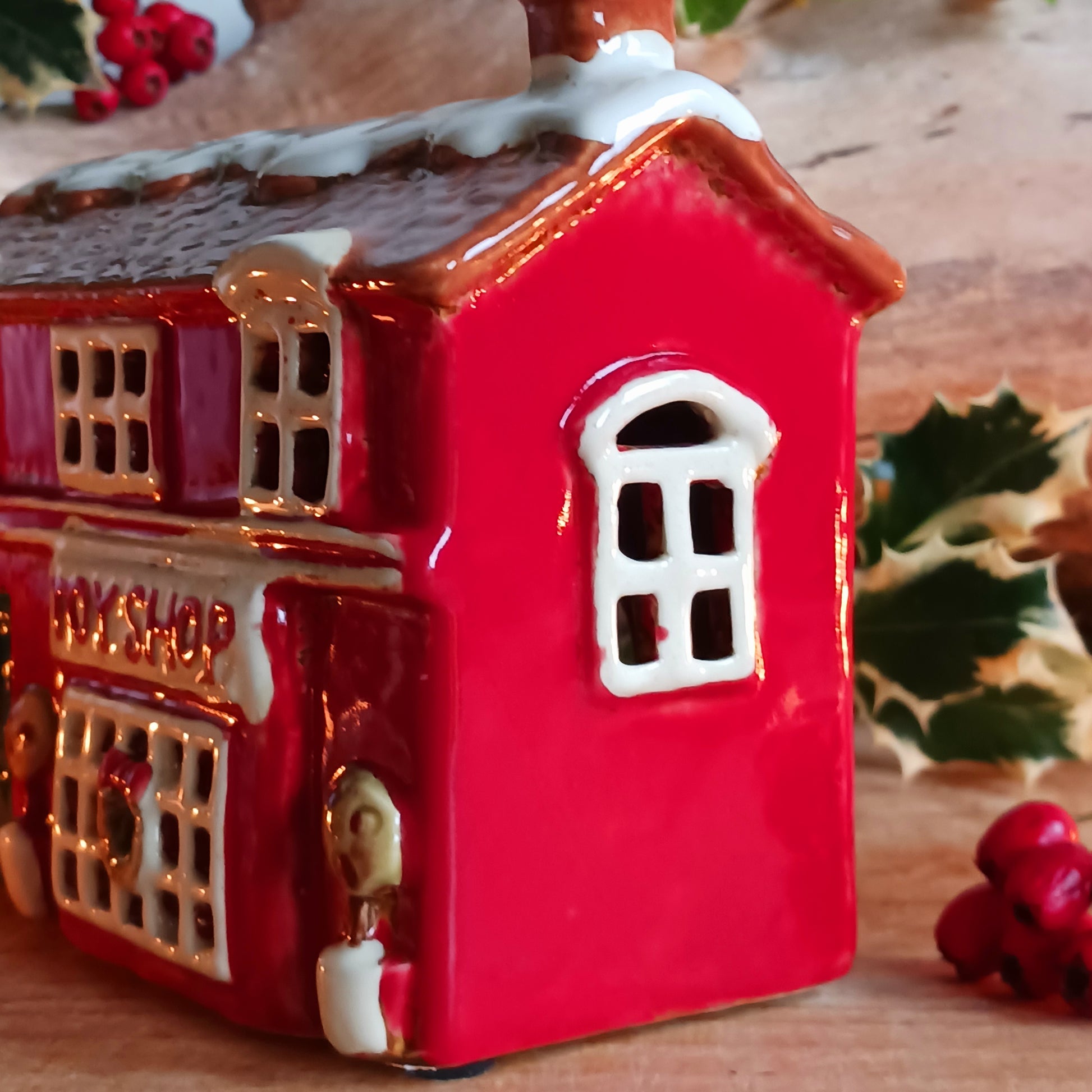 Bring nostalgic festive charm to your home with our Christmas Toy Shop Ceramic Tealight Holder, handcrafted in the Village Pottery workshop. This detailed tealight house captures the magic of an old-world toy shop on a snowy winter’s evening. 