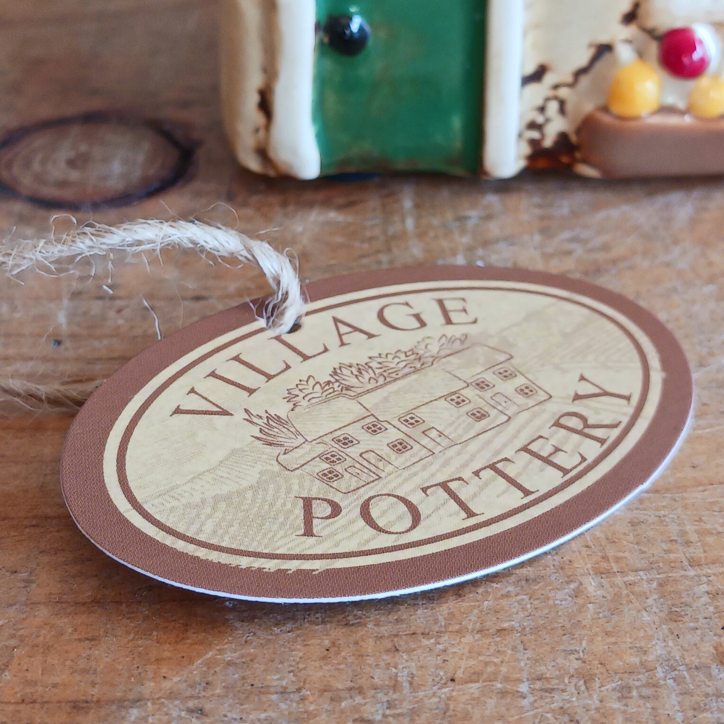 Illuminate your home with the charming Village Pottery Green Grocers Shop Tealight Holder. Handcrafted with a rustic green finish, this cosy piece adds warmth and ambience to any room. Perfect for tealights or simply as a decorative ornament, it’s a delightful addition to shelves, windowsills, or coffee tables. Pair with other pieces from the Village Pottery Collection to create your own quaint, decorative village.