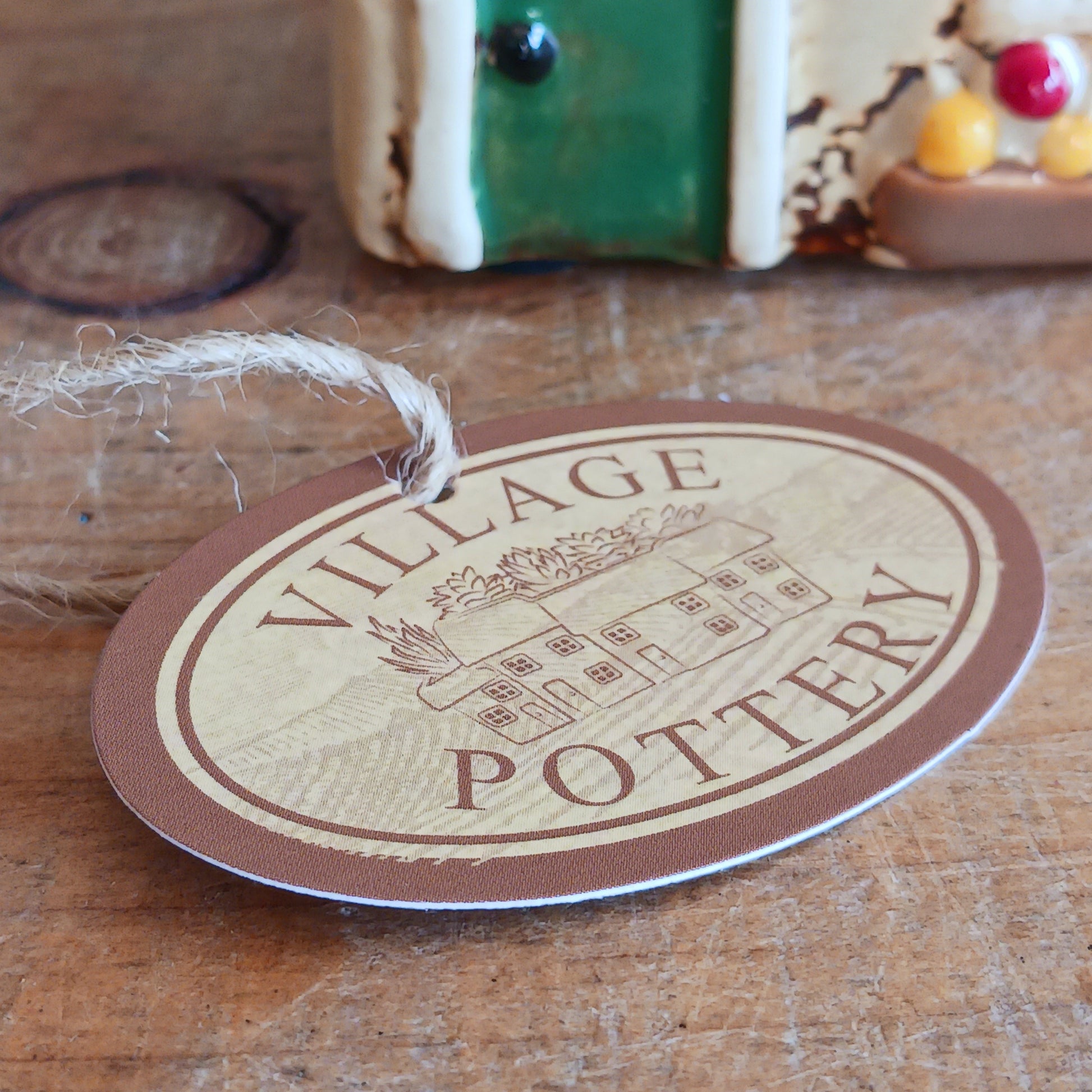 Illuminate your home with the charming Village Pottery Green Grocers Shop Tealight Holder. Handcrafted with a rustic green finish, this cosy piece adds warmth and ambience to any room. Perfect for tealights or simply as a decorative ornament, it’s a delightful addition to shelves, windowsills, or coffee tables. Pair with other pieces from the Village Pottery Collection to create your own quaint, decorative village.