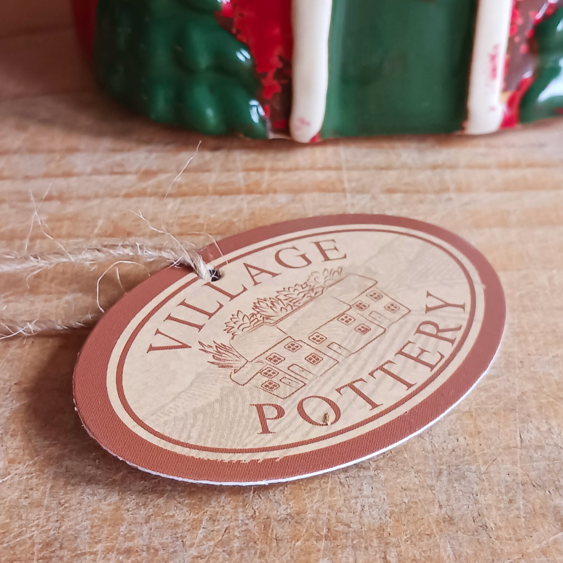 Bring timeless holiday charm to your home with this Handcrafted Christmas Oil Wax Warmer by Village Pottery. Designed in the shape of a festive wreath, this ceramic warmer combines beauty and practicality for the holiday season. Perfect for wax melts or essential oils, it creates a warm and inviting atmosphere as the fragrance fills your space.