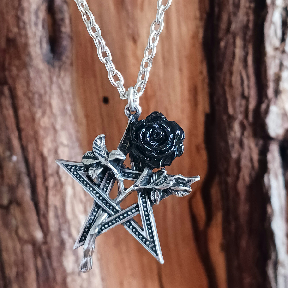 Embrace dark romance and mystical symbolism with this striking Alchemy England Gothic Pentagram and Black Rose Necklace. Featuring a detailed pewter pentagram entwined with a beautiful black-petalled rose, this distinctive gothic pendant combines spiritual symbolism with the timeless beauty of romantic gothic jewellery.