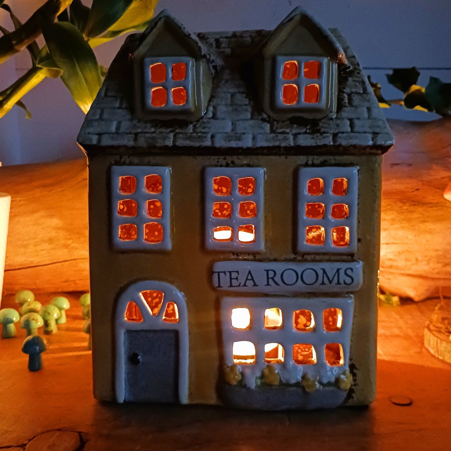 Transform your home into a warm and inviting sanctuary with the Village Pottery Tea Rooms Tealight Holder. Crafted from quality ceramic, this charming rustic piece creates a cosy, nostalgic glow when lit with a tealight. More than just a candle holder, it doubles as a delightful decorative ornament for your coffee table, shelf, or windowsill. 