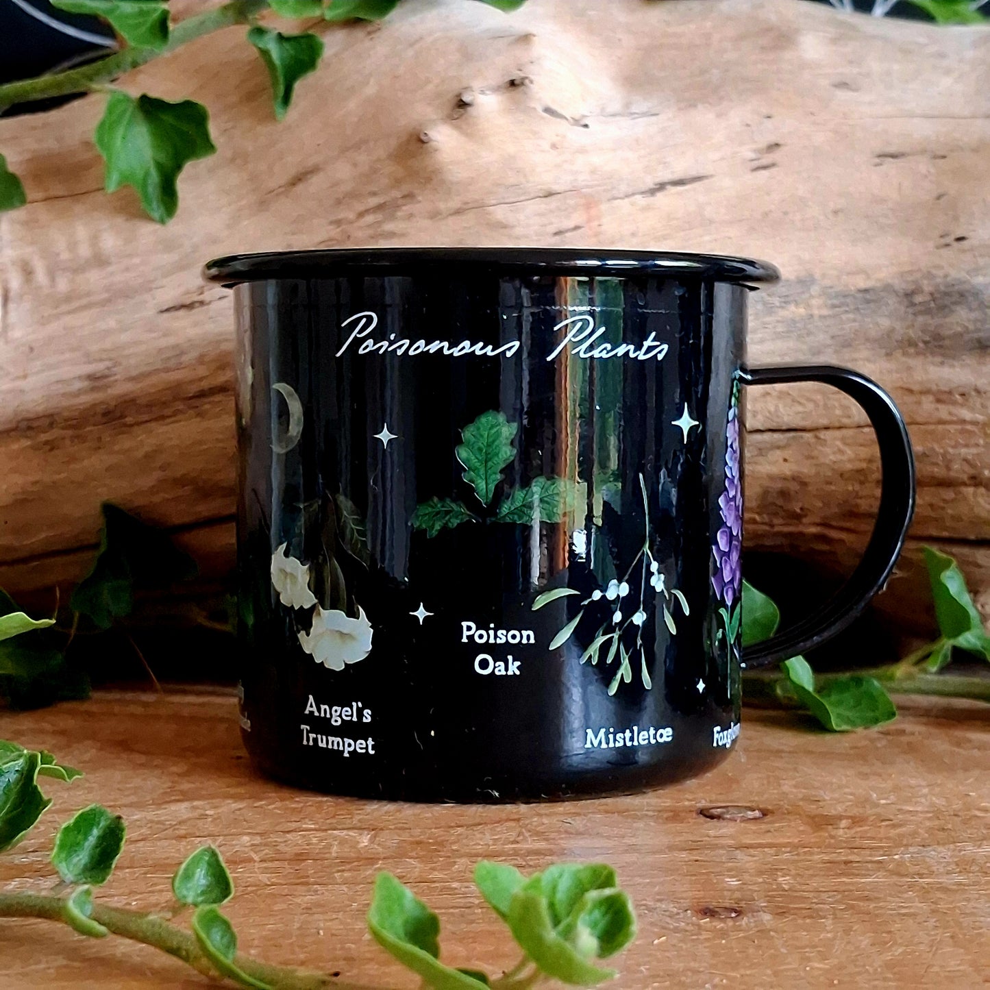 Start your mornings with a touch of gothic elegance. This black enamel-style mug is adorned with intricate illustrations of notorious poisonous plants, including poison ivy, hemlock, deadly nightshade, angel’s trumpet, poison oak, mistletoe, and foxglove. Perfect for tea, coffee, or any dark brew of your choice, this mug blends botanical beauty with a mysterious edge.