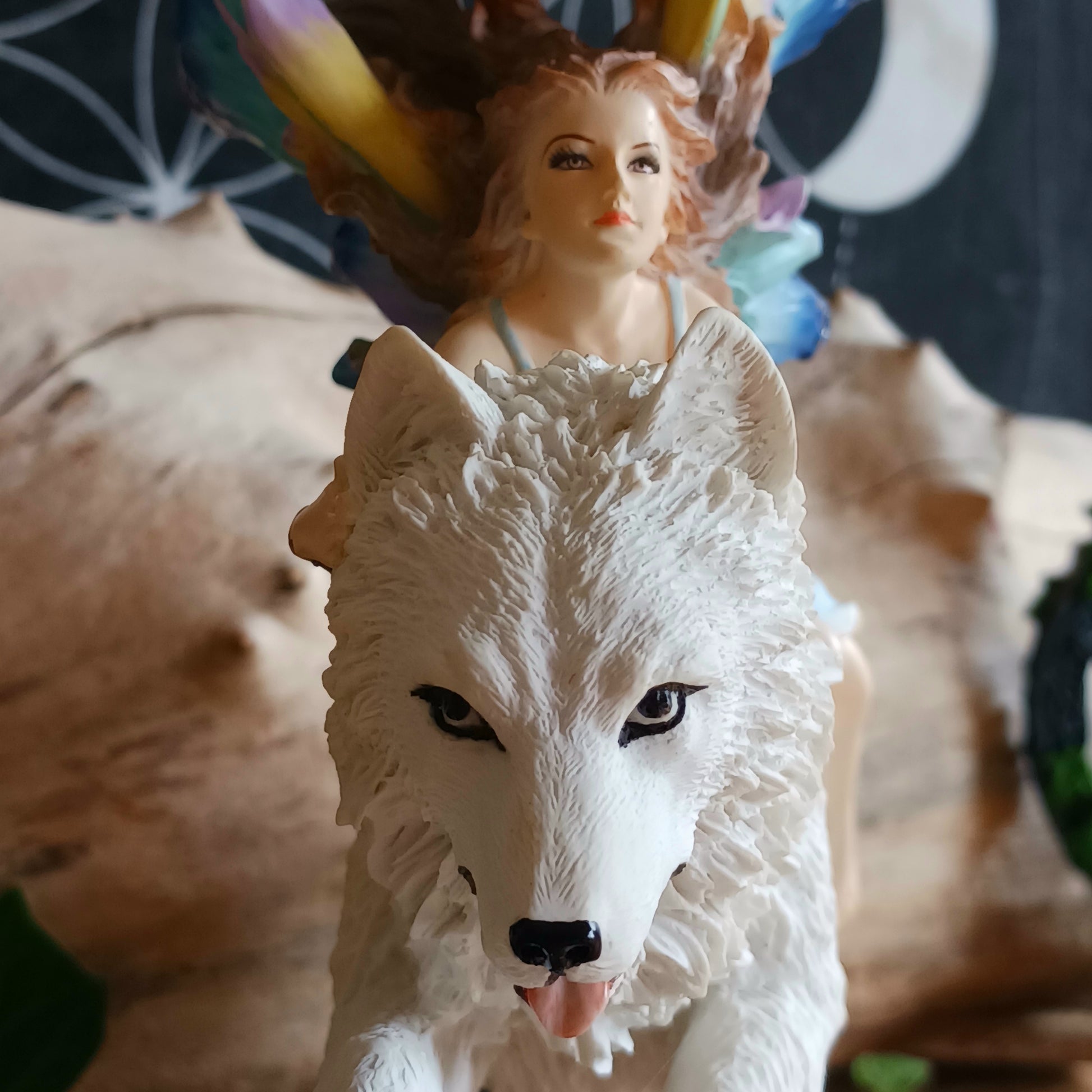 Bring a touch of magical fantasy to your home with this beautifully detailed Fairy Riding A White Wolf Statue from Nemesis Now. The dramatic figurine depicts a graceful fairy riding her loyal white wolf companion as they leap over a flowing stream, creating a striking sense of movement and adventure.