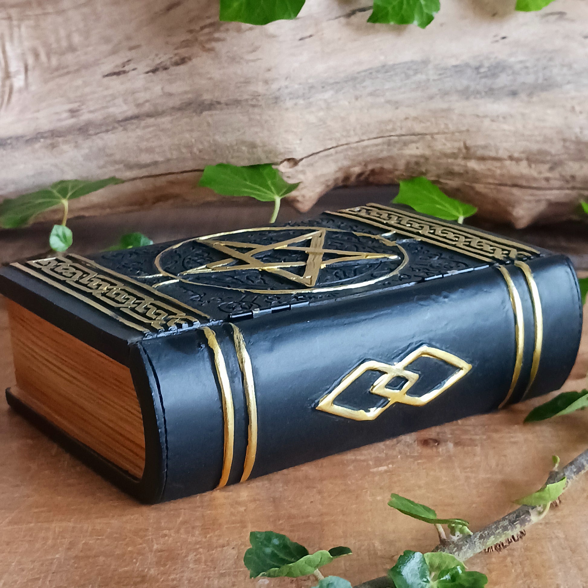 Evoke the power of the old ways with this enchanting Spell Box Grimoire Storage Box from Nemesis Now. Designed to resemble an ancient spell book, this beautifully decorated grimoire opens to reveal a hidden storage compartment—perfect for keeping your magical tools, crystals, herbs, spell ingredients, or keepsakes safely stored.