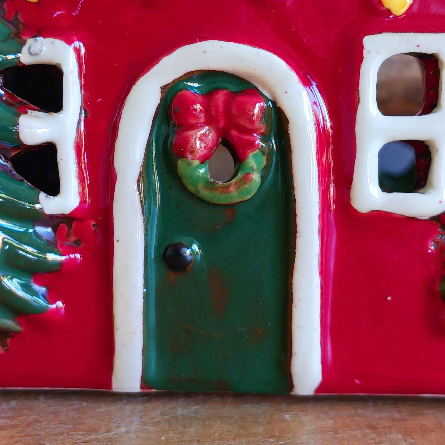 Bring timeless festive charm into your home with the Village Pottery Christmas Thatched Roof House Tealight Holder, a handcrafted ceramic cottage glowing with the spirit of the season. Measuring 17 x 12.5 x 8.5 cm, this enchanting piece captures the essence of a peaceful winter’s night — where golden candlelight flickers through snowy windows beneath a soft thatched roof.