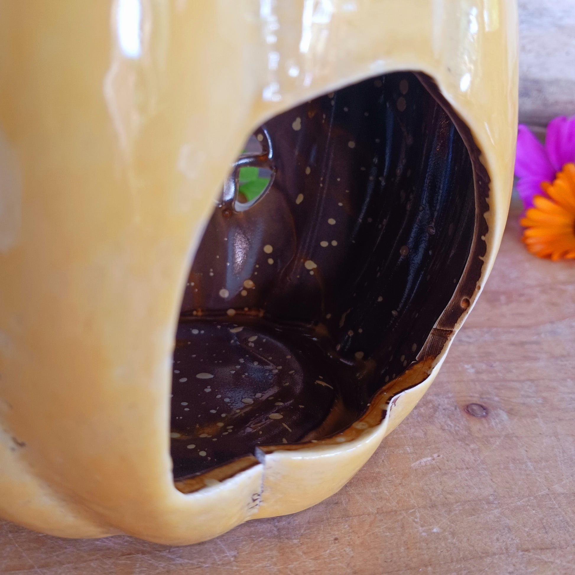 Invite a little woodland wonder into your home with the Village Pottery Pumpkin House Tealight Holder, a delightful hand-painted creation in a soft yellow ceramic glaze. Measuring 17 x 13 x 11 cm, this fairy-tale pumpkin cottage glows beautifully when lit, filling your space with warmth, light, and a touch of enchantment.