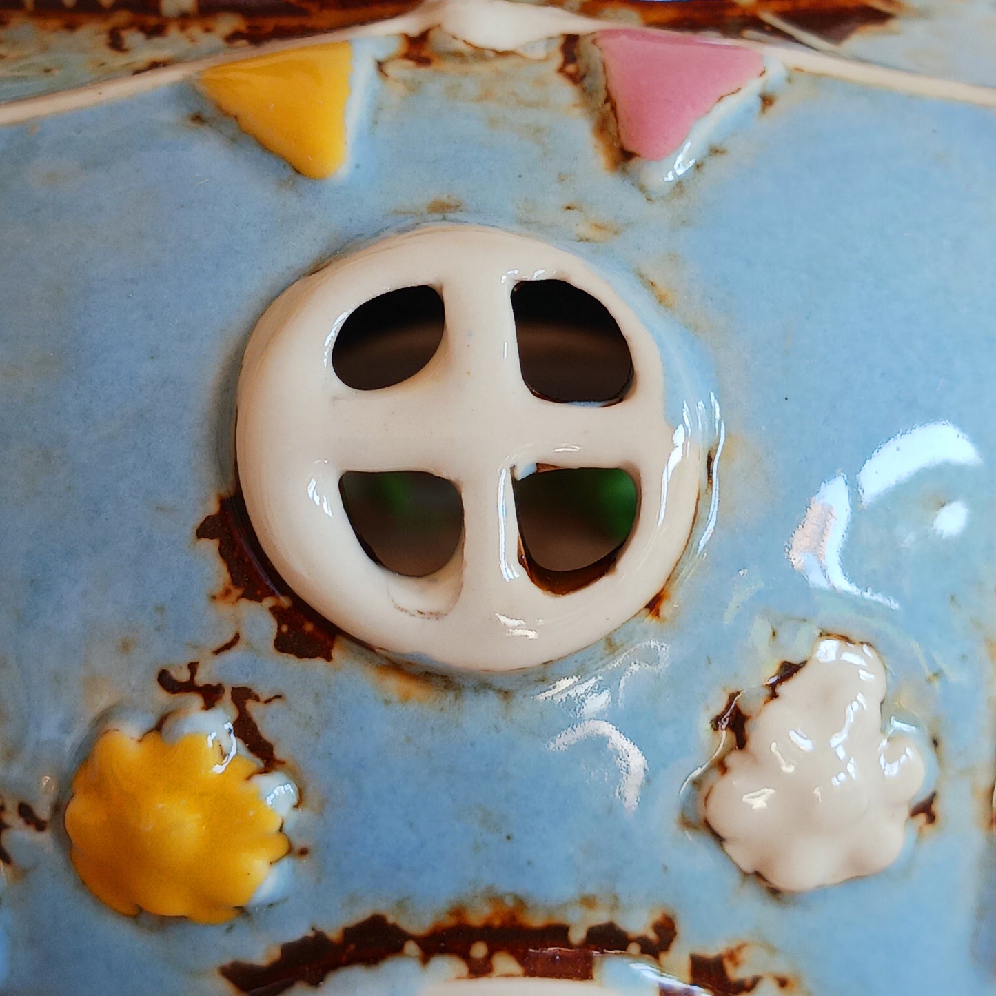 Create a warm and cosy atmosphere in your home with this charming Round Teapot Tealight Holder from the Village Pottery Collection. Crafted in a unique teapot shape, this ceramic tealight holder makes a delightful decorative piece for shelves, windowsills, or side tables. Simply place a tealight inside to enjoy a soft, glowing ambience.