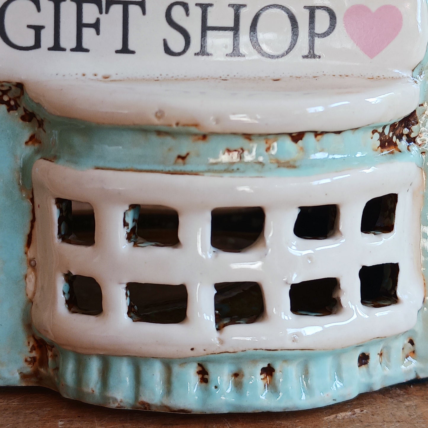 Transform your home into a warm and inviting sanctuary with the Village Pottery Gift Shop Tealight Holder. Crafted from quality ceramic, this charming piece creates a cosy, nostalgic glow when lit with a tealight. More than just a candle holder, it doubles as a delightful decorative ornament for your coffee table, shelf, or windowsill.