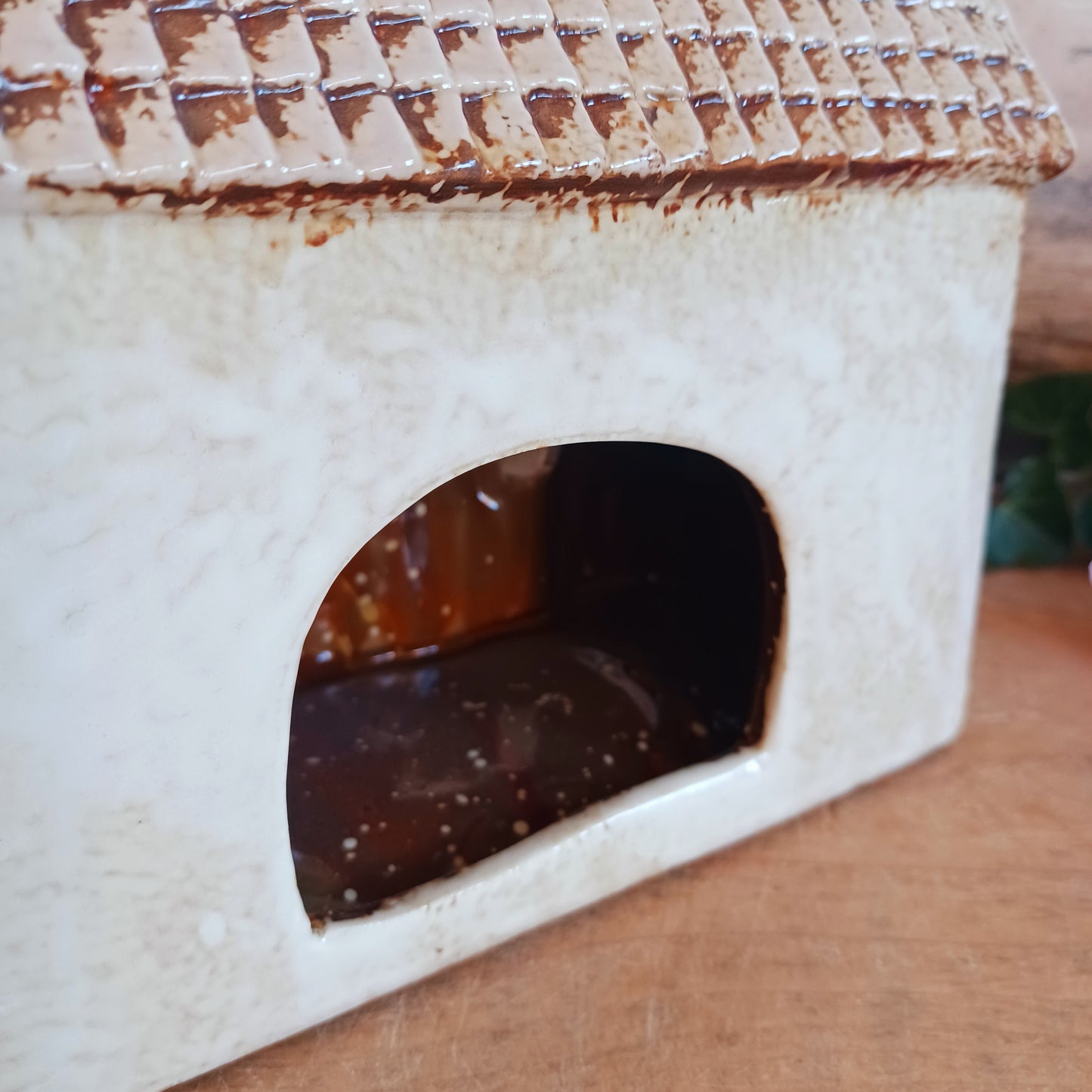 Nestled at the edge of a quiet enchanted village, The Stables tealight house by Village Pottery glows with a soft, grounding warmth. Crafted from ceramic and measuring 17x8x8cm, this rustic stable invites candlelight to flicker through its windows like a lantern for wandering spirits and kindred souls.