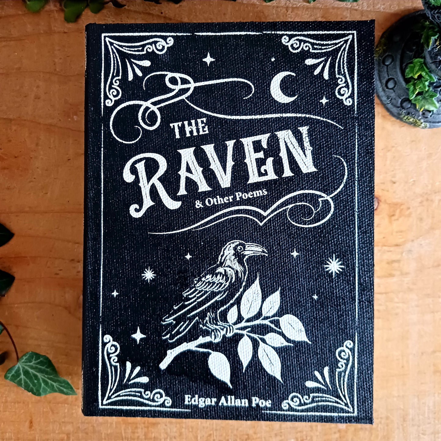 The Raven Book Shaped Storage Box is a gothic keepsake inspired by Edgar Allan Poe’s timeless poem The Raven.