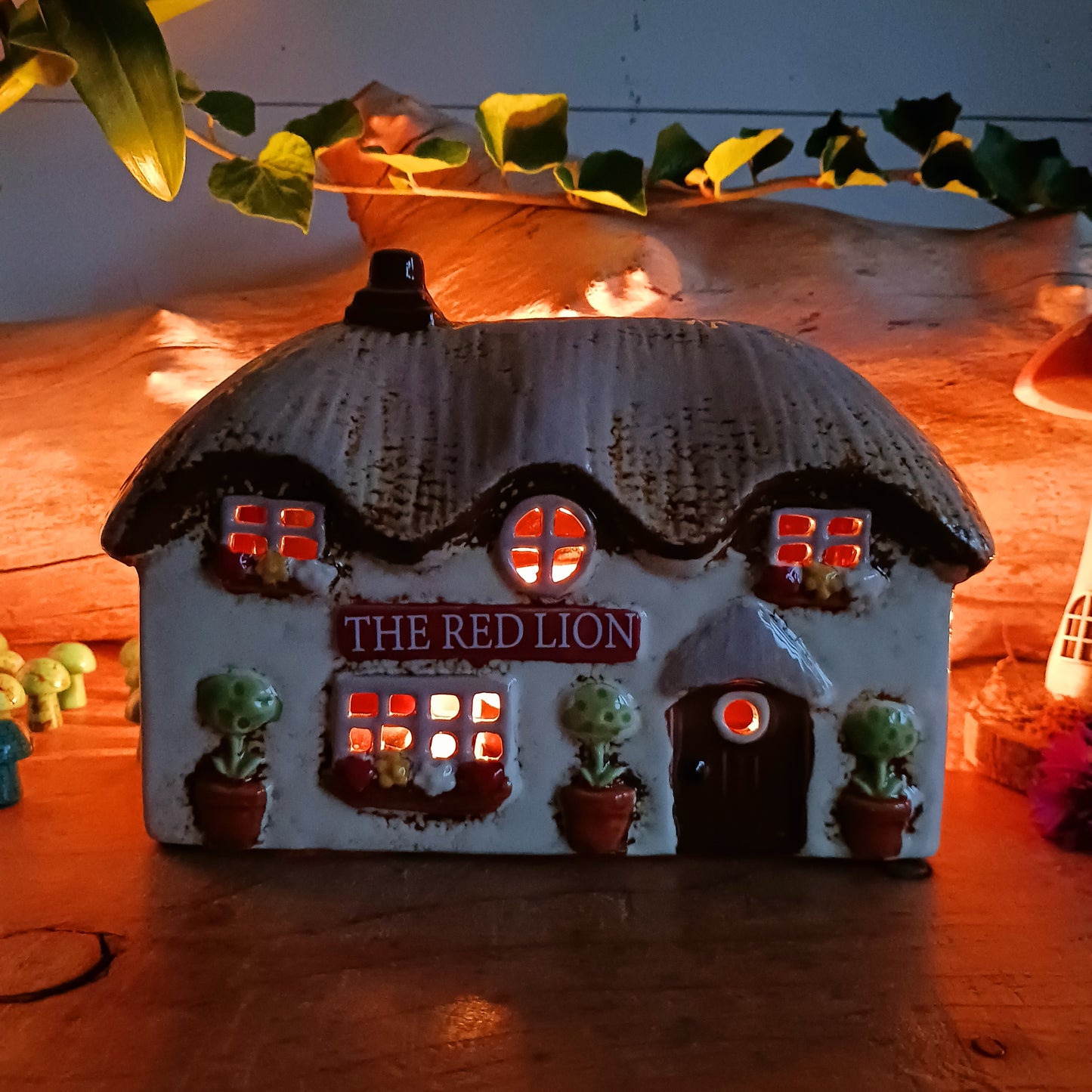 Illuminate your home with the charming Red Lion Pub Tealight Holder from the Village Pottery Collection. Crafted from quality ceramic, this delightful tealight holder adds warmth and character to any space.