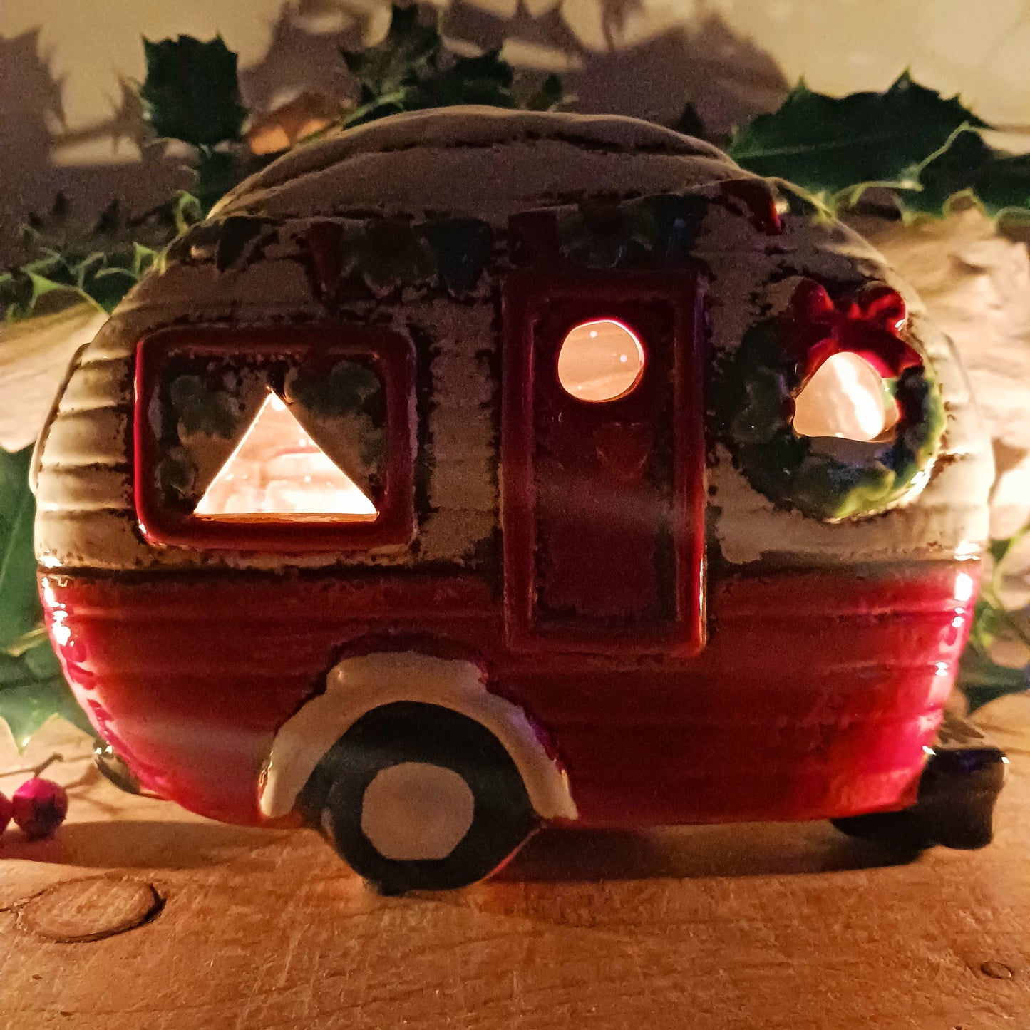 Step into a cosy winter wonderland with the Village Pottery Christmas Caravan Tealight Holder, a heart-warming piece crafted with love and festive magic. Measuring 13.5 x 18.5 x 7 cm, this hand-painted ceramic caravan glows with Christmas cheer, ready to light up your home with a gentle, enchanting flicker.