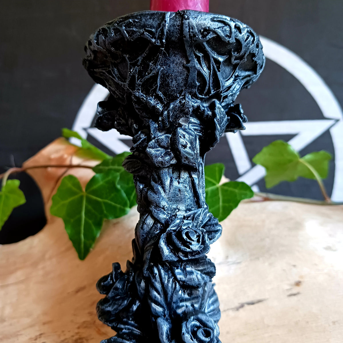 Add a touch of dark elegance to your home with the Midnight Rose Gothic Candlestick Holder. Beautifully crafted with a stone pillar design, this striking ornament features intricate black roses and dark vegetation, creating a mysterious gothic aesthetic that makes a statement in any room.