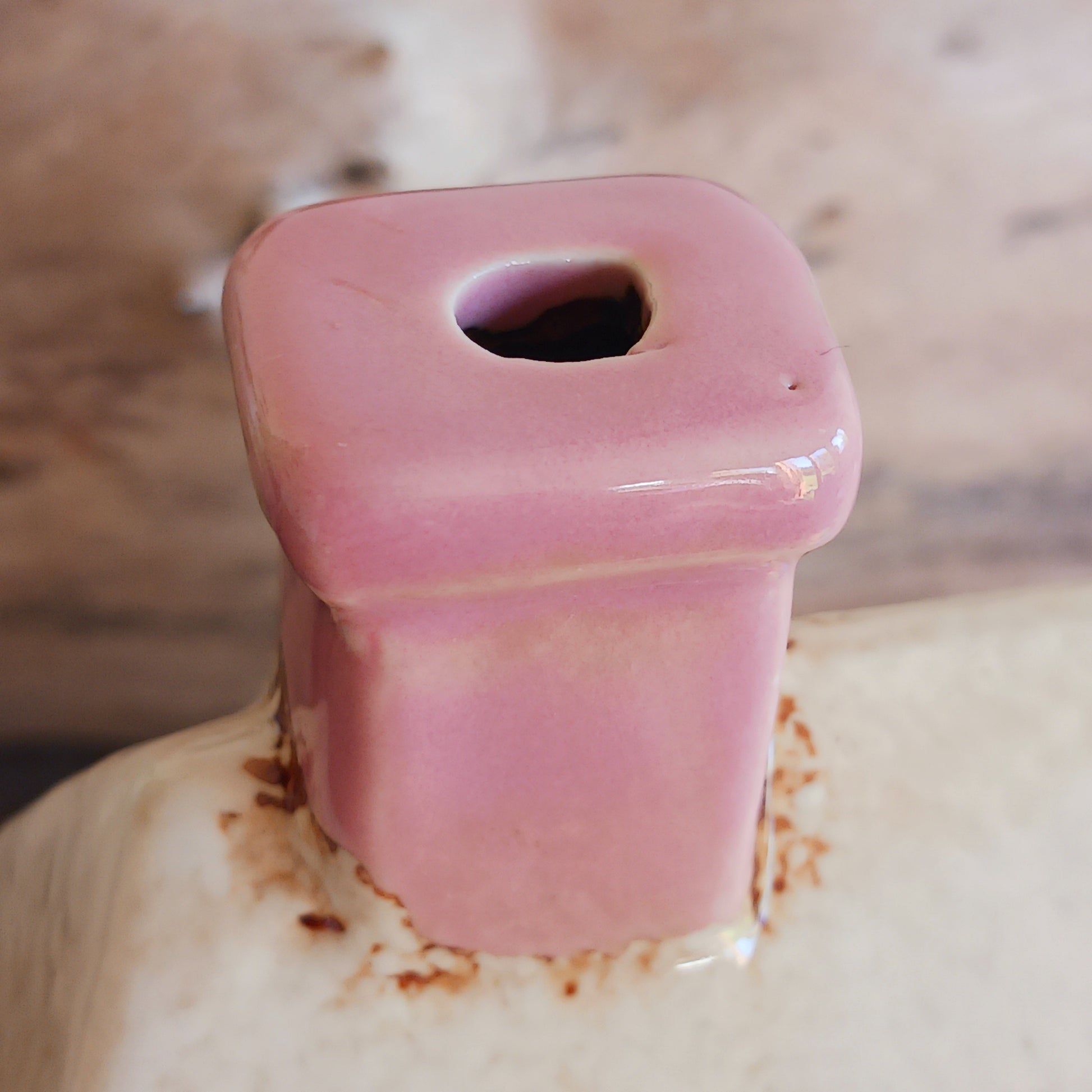 A comforting glow brews within the Coffee Pot Shop, where candlelight flickers like steam rising from a warm cup in a quiet enchanted village. This Shudehill Village Pottery tealight house is crafted from ceramic, casting a soft, golden light through its windows to create a scene of calm and gentle magic.