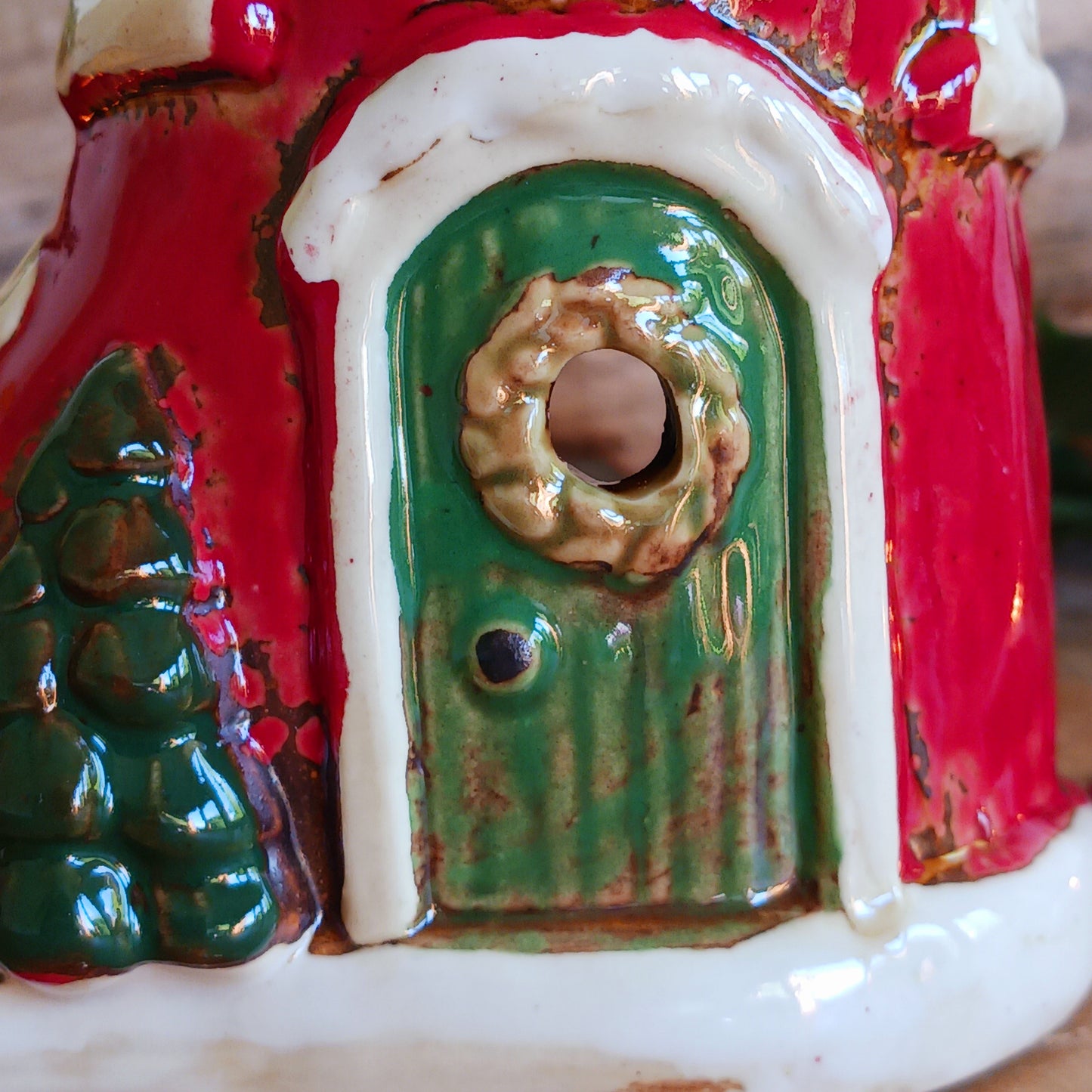 Step into the world of festive enchantment with the Village Pottery Christmas Elf Boot House Tealight Holder, a playful handcrafted ceramic creation bursting with Christmas spirit. Measuring 16 x 16 x 9.5 cm, this delightful piece takes the shape of a cheerful elf’s boot turned into a cosy little house, complete with twinkling windows and snowy details.