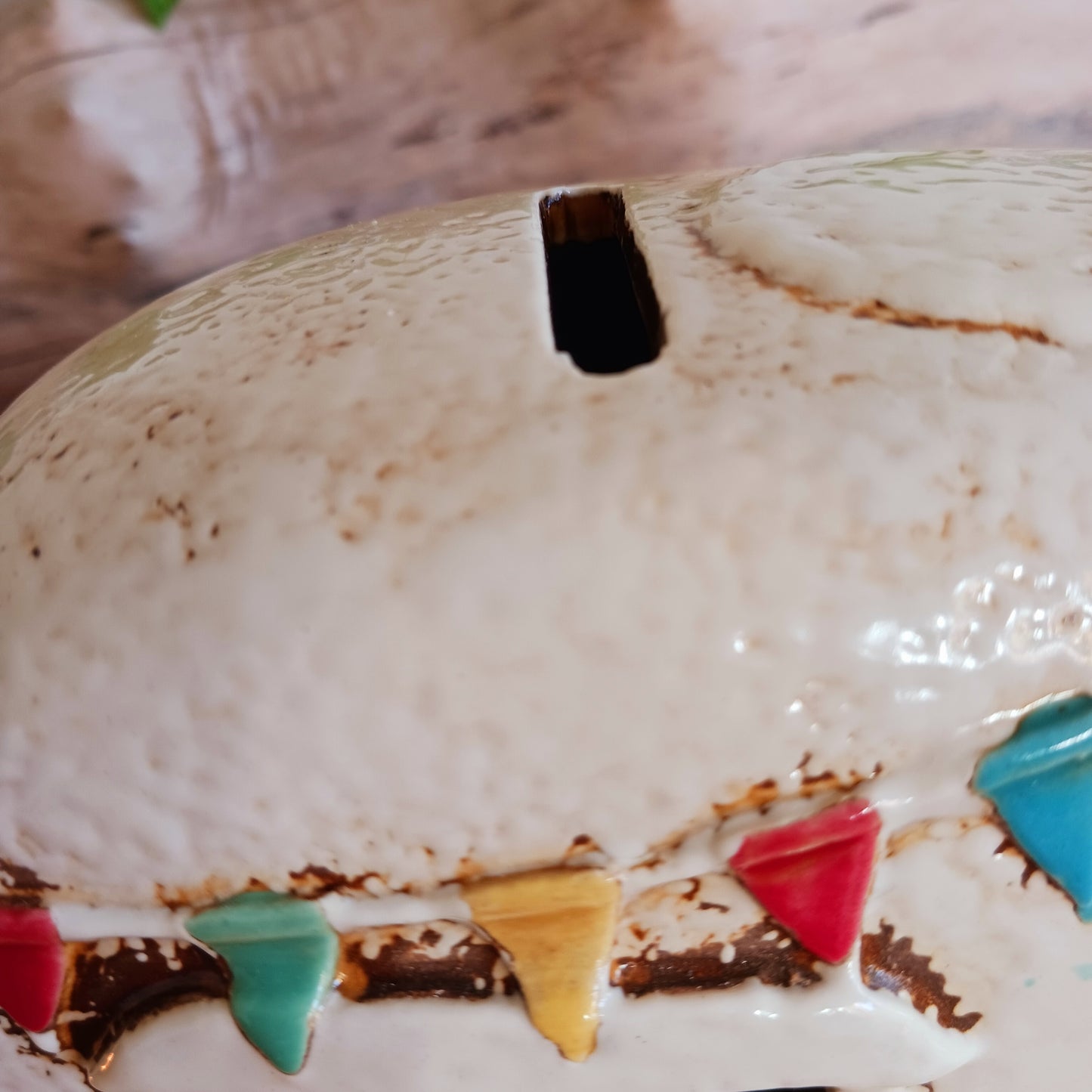 From the enchanted lanes of Village Pottery comes this Aqua Caravan Money Box, a charming ceramic treasure crafted for dreamers and wanderers alike. Measuring 13.5 x 18.5 x 6.5 cm, this delightful piece captures the spirit of adventure with its soft aqua glaze, vintage caravan design, and hand-painted detailing that feels kissed by fairy dust.