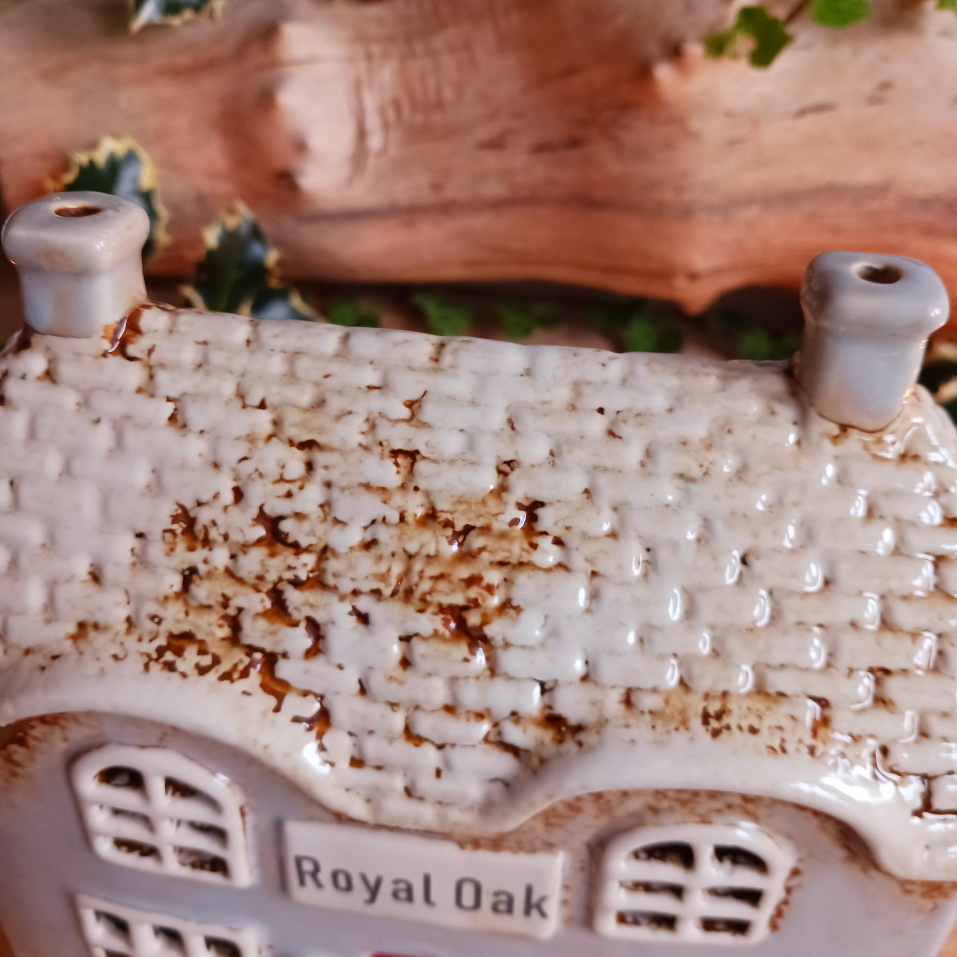 Bring the charm of traditional village life into your home with the Royal Oak Pub Ceramic Tealight Holder. Handcrafted in the Village Pottery workshop, this timeless piece features intricate detailing and rustic finishes inspired by a classic village pub.