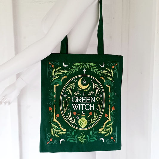 The Green Witch Tote Bag is a practical and stylish companion for carrying freshly picked herbs, spell books, or everyday essentials. 