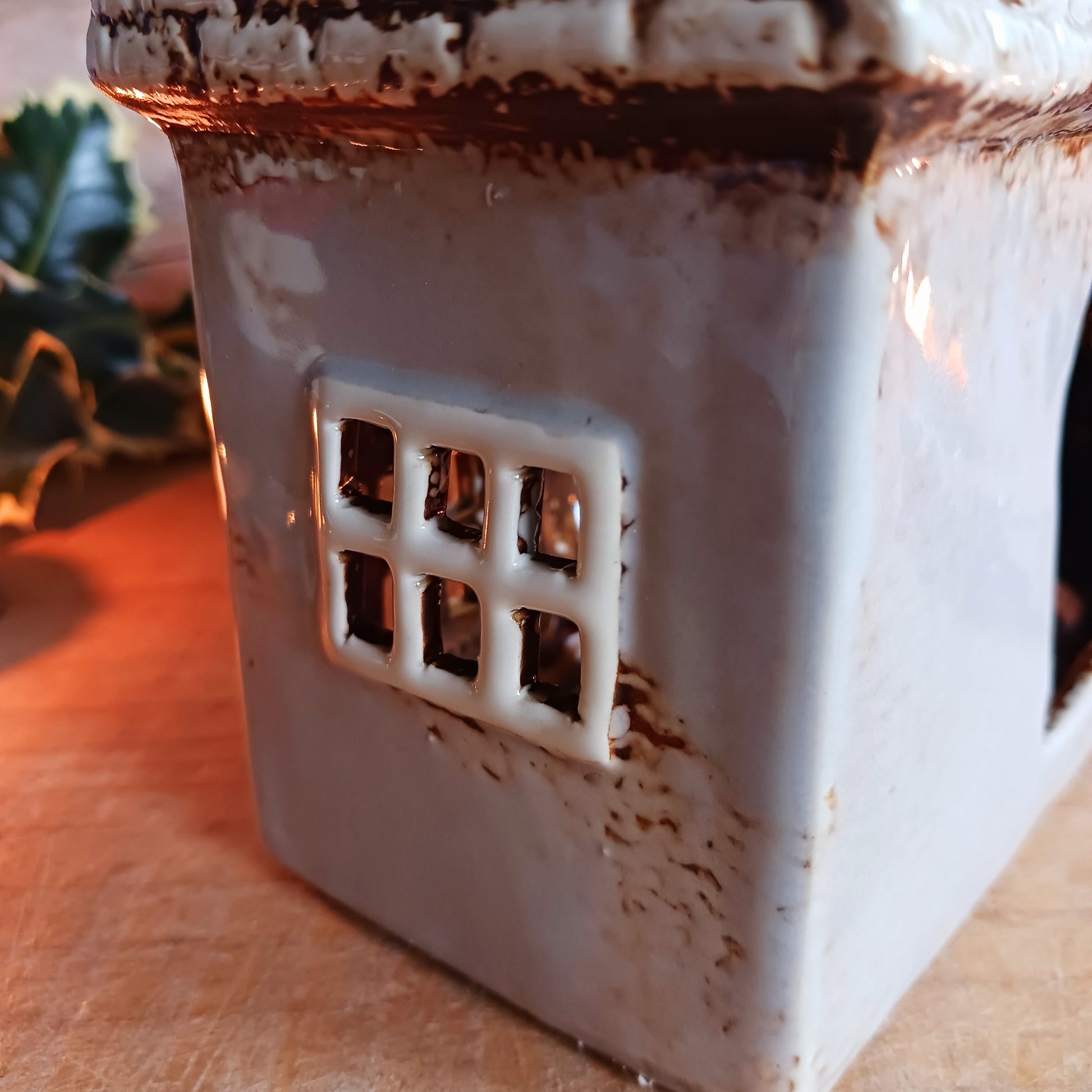 Bring the charm of traditional village life into your home with the Royal Oak Pub Ceramic Tealight Holder. Handcrafted in the Village Pottery workshop, this timeless piece features intricate detailing and rustic finishes inspired by a classic village pub.