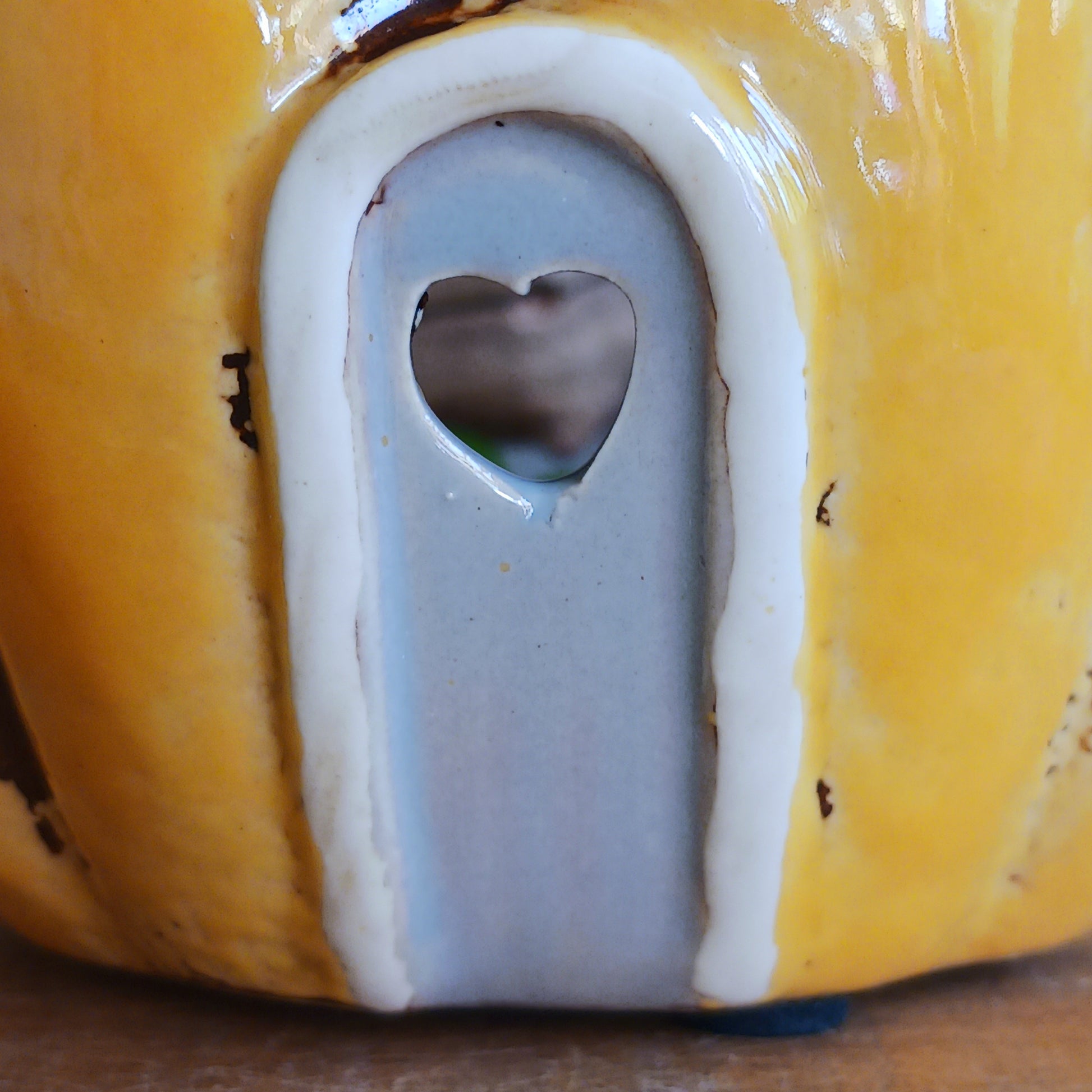 Invite a little woodland wonder into your home with the Village Pottery Pumpkin House Tealight Holder, a delightful hand-painted creation in a soft yellow ceramic glaze. Measuring 17 x 13 x 11 cm, this fairy-tale pumpkin cottage glows beautifully when lit, filling your space with warmth, light, and a touch of enchantment.