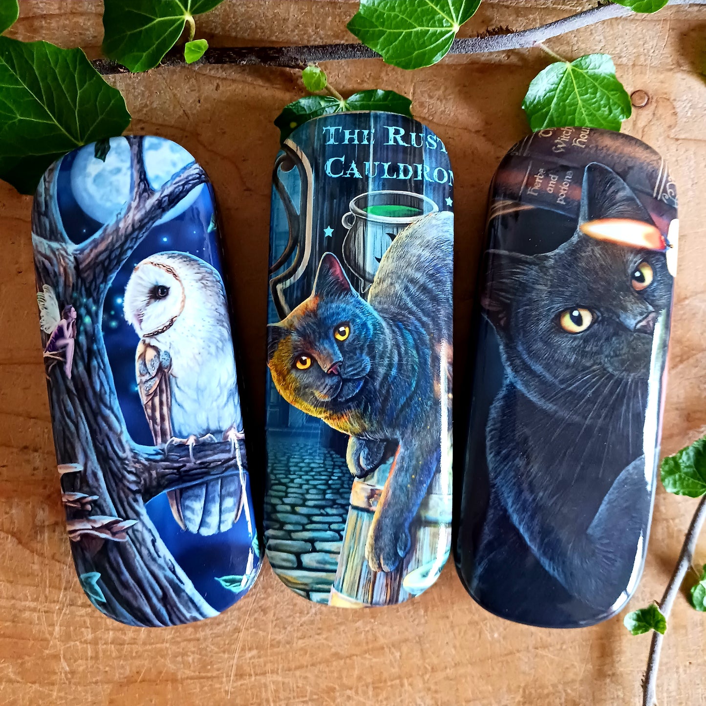 Protect your eyewear in spellbinding style with the Witching Hour Glasses Case by renowned fantasy artist Lisa Parker. Featuring the captivating Witching Hour artwork, this enchanting case is brought to life with vibrant, high-quality printing that truly stands out.