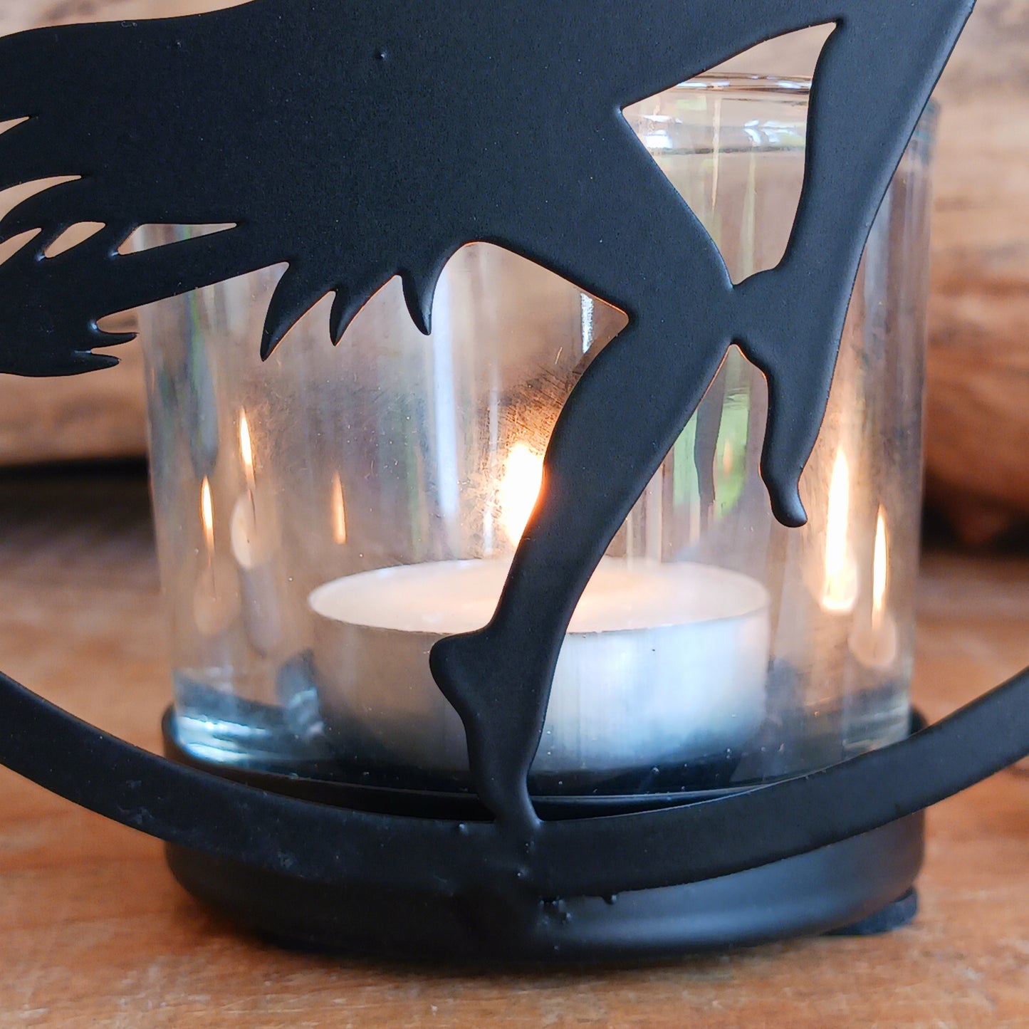 Illuminate your space with the mystical allure of Witch by Moonlight. Crafted from black-coated iron and glass, this enchanting T-light holder depicts the classic silhouette of a witch soaring across a glowing full moon. A tribute to freedom, transformation, and the deep feminine magic within us all, it radiates both mystery and beauty.