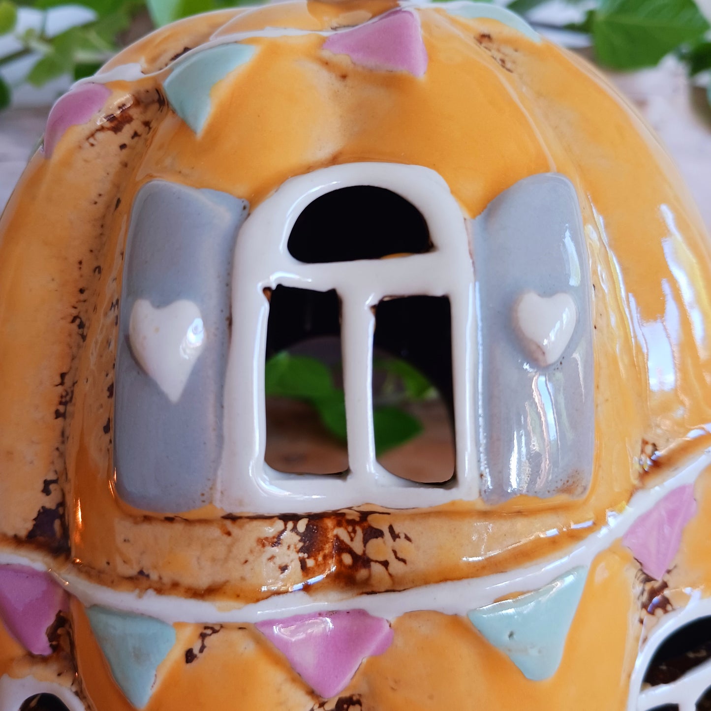 Invite a little woodland wonder into your home with the Village Pottery Pumpkin House Tealight Holder, a delightful hand-painted creation in a soft yellow ceramic glaze. Measuring 17 x 13 x 11 cm, this fairy-tale pumpkin cottage glows beautifully when lit, filling your space with warmth, light, and a touch of enchantment.