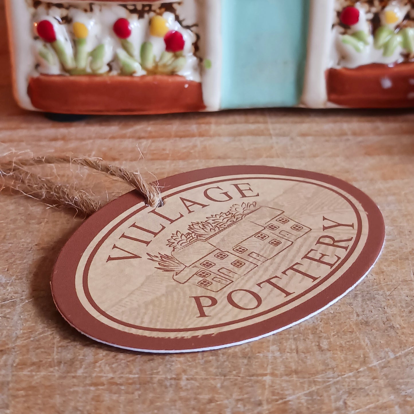 Handcrafted in the Village Pottery workshop, this Florist Tealight Holder is a true collectible from the Shudehill Collection. Made from fine ceramic with intricate detailing, it captures the nostalgic charm of a festive florist shop in a snow-dusted winter village scene.