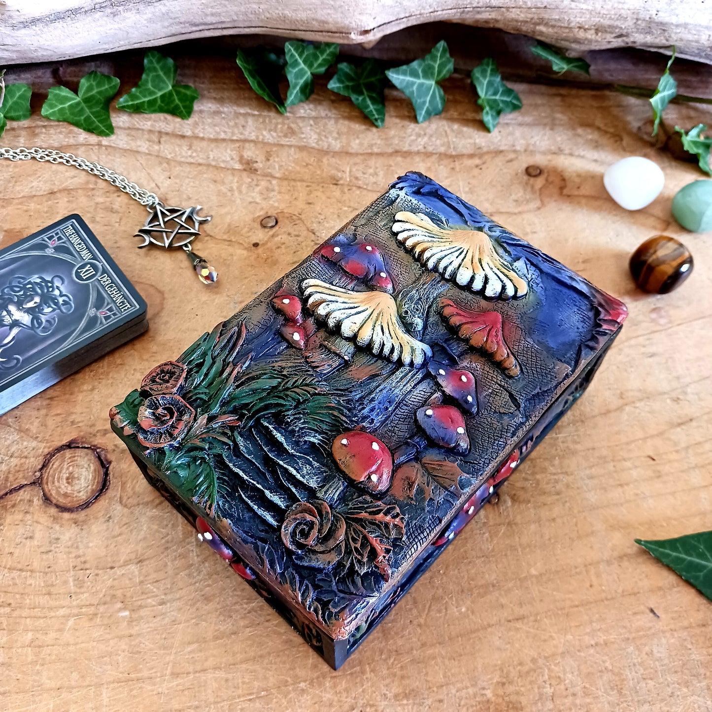 Bring a touch of mystery and magic to your home with this beautiful trinket box, featuring intricate hand-painted mushroom illustrations set against a dreamy backdrop. Perfect for modern, bohemian, or eclectic spaces, it’s as functional as it is enchanting.