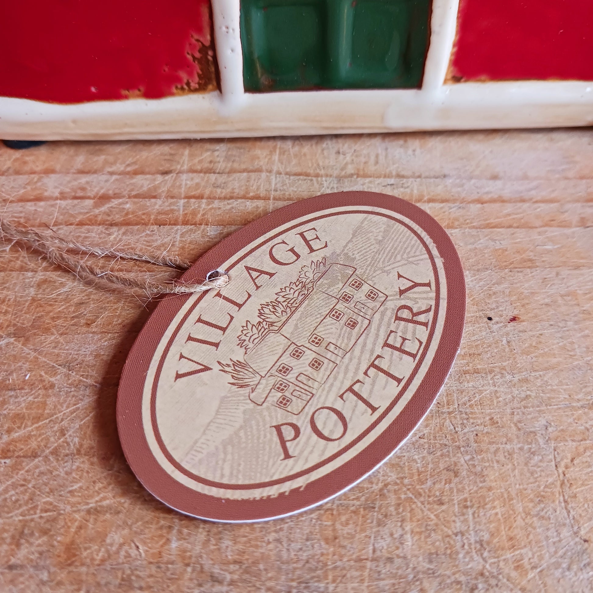 Bring timeless festive charm to your home with this hand-crafted Christmas Traditional House Tealight Holder from The Village Pottery. Carefully shaped in ceramic and finished with rustic detailing, it captures the magic of a snow-covered village scene. 